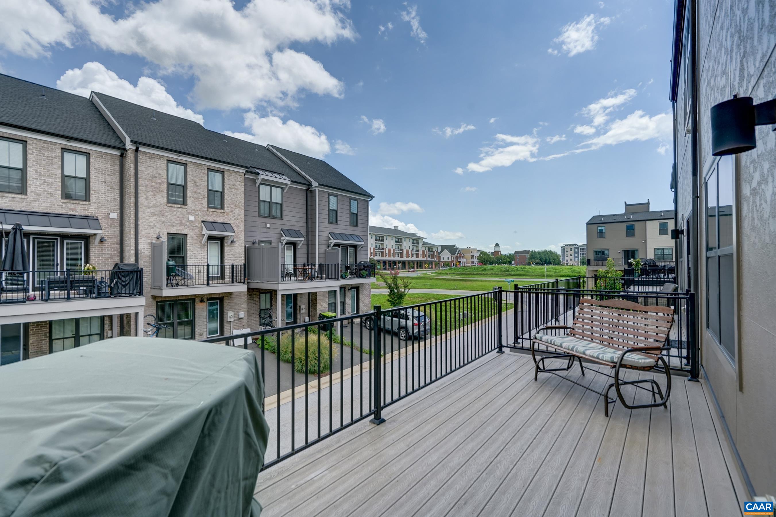 Composite deck at rear for outdoor dining and grilling.