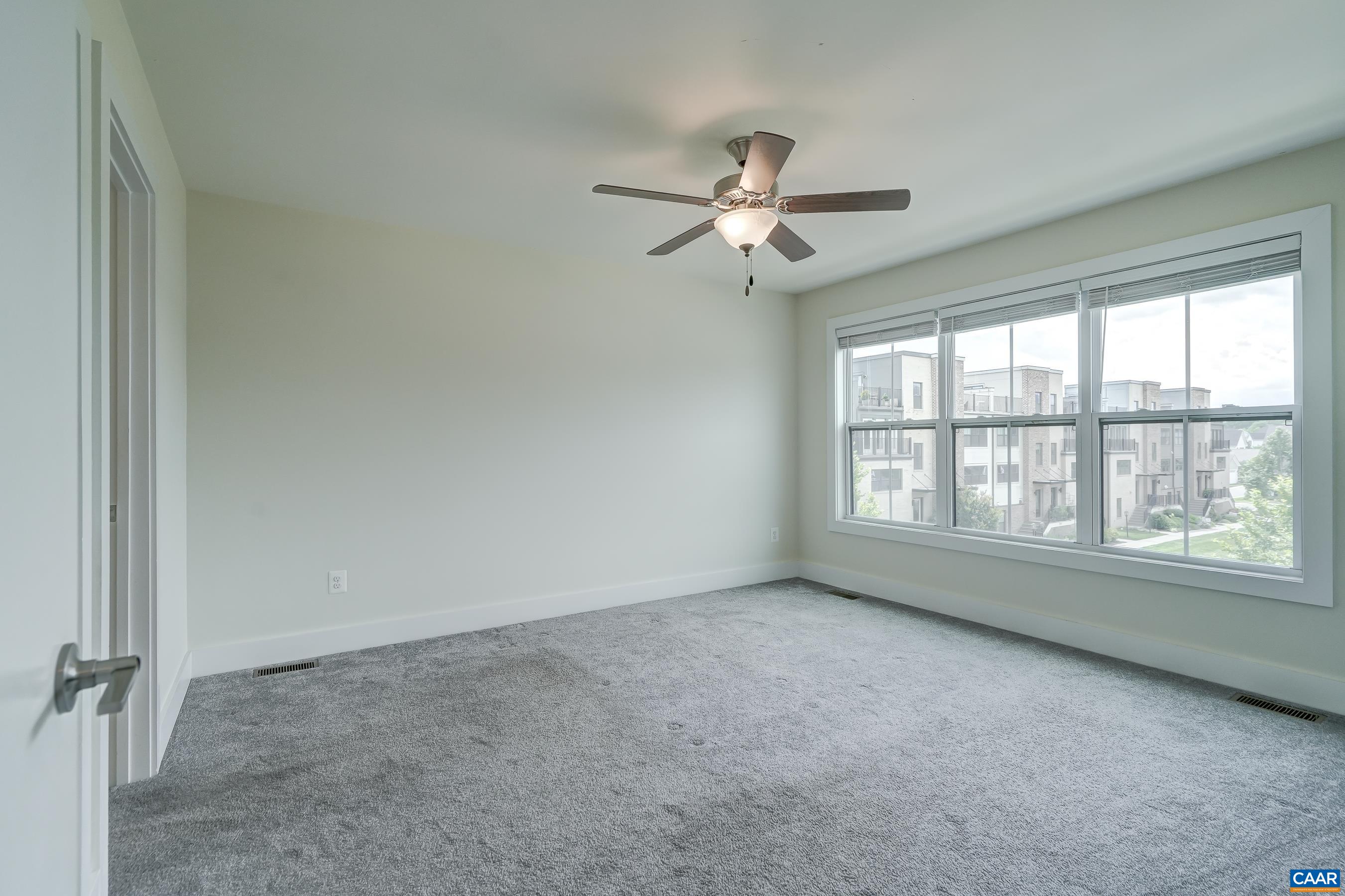 Primary suite with walk in closet and ensuite bathroom.