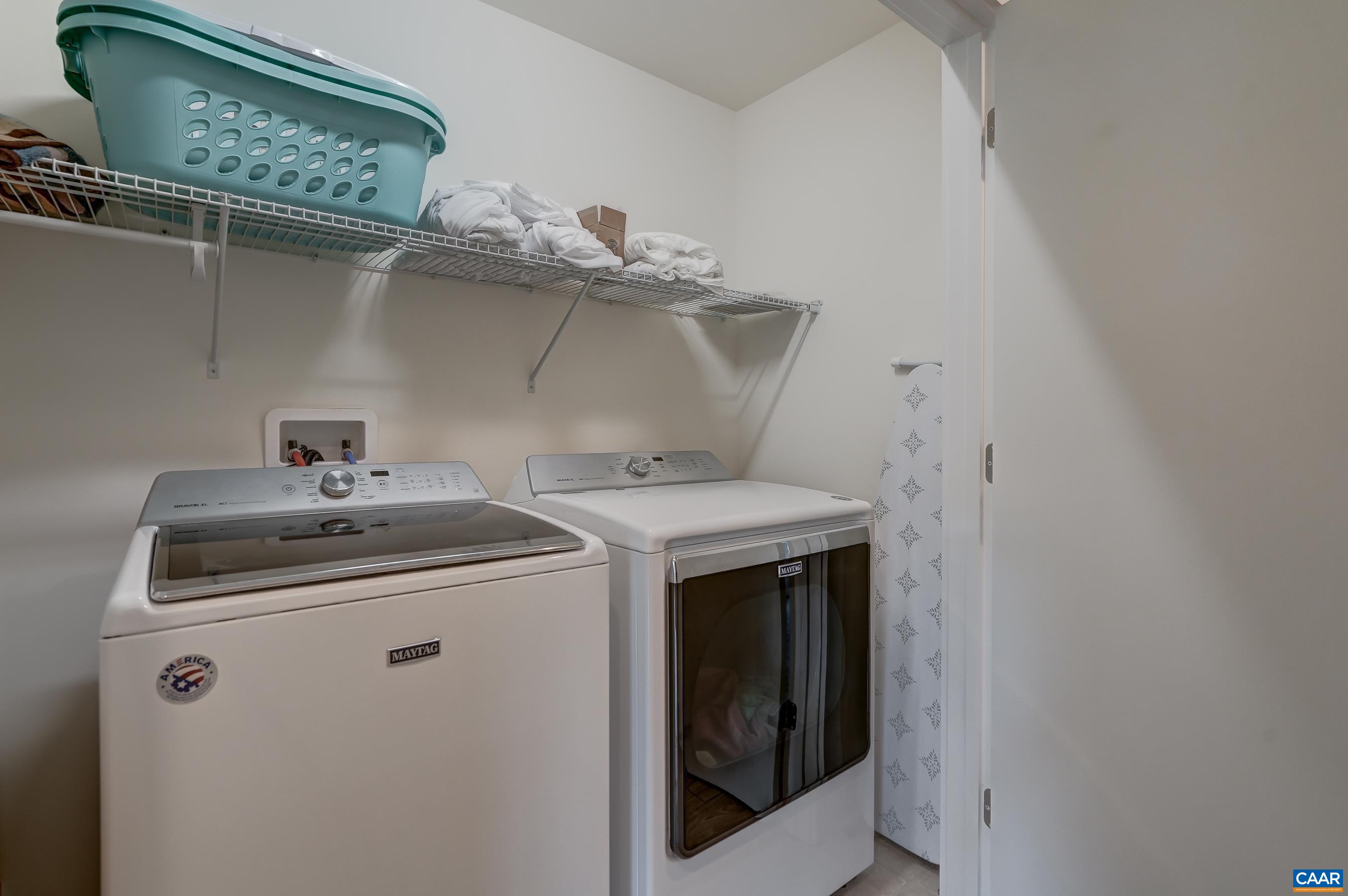 Large laundry room on the bedroom level features Maytag full sized washer and dryer.