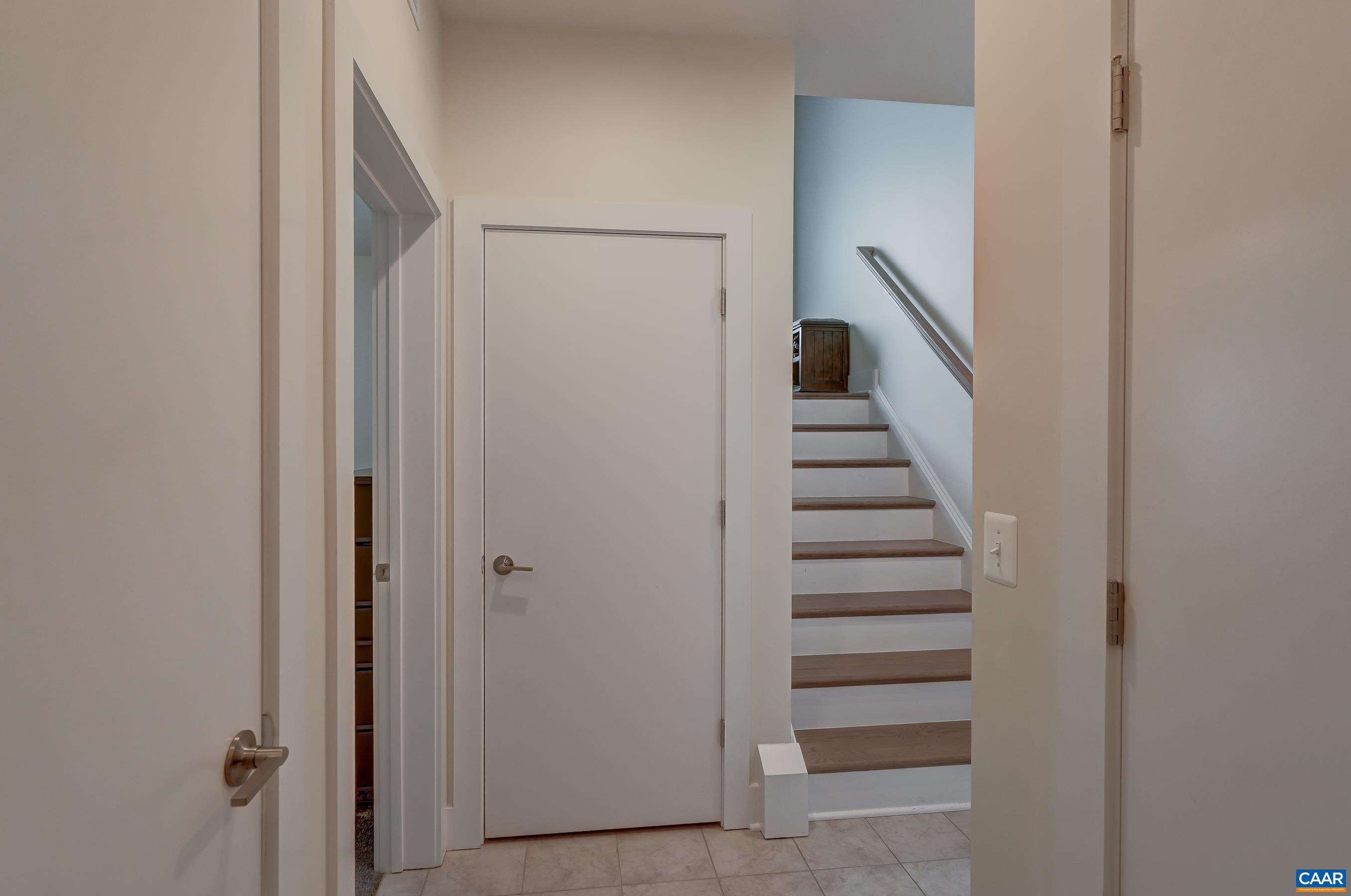 Lower level features ceramic tile entryway.