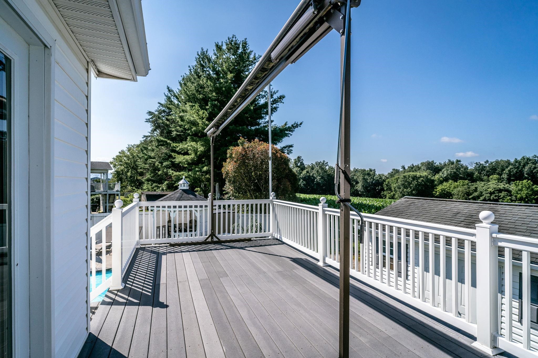 Decking, railing & fencing low maintenance. Awning frame solid, awning has wear and is being sold as is.