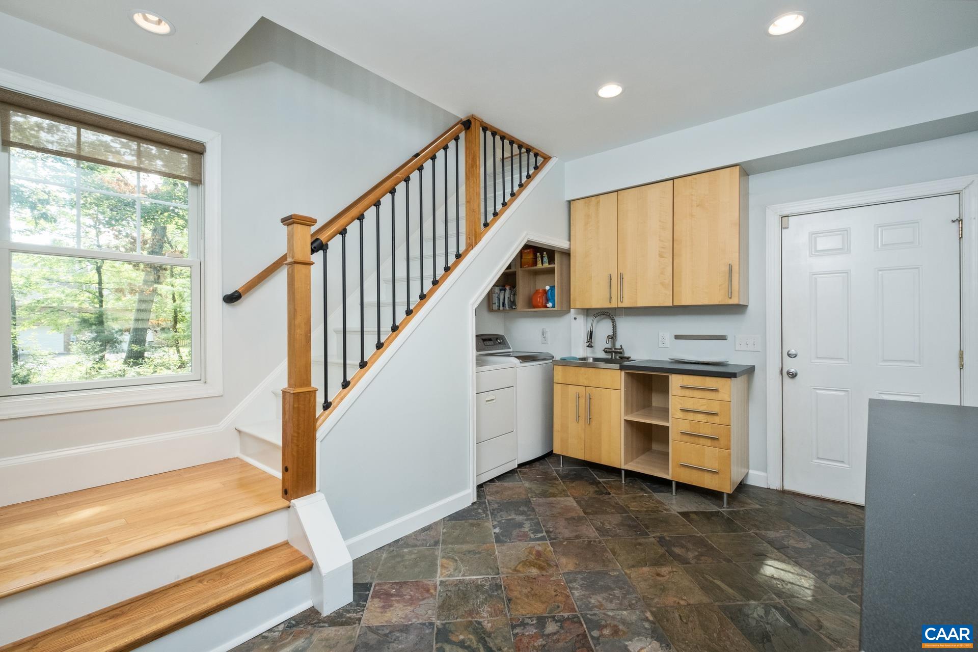 Stairs leading to addition or out to second garage