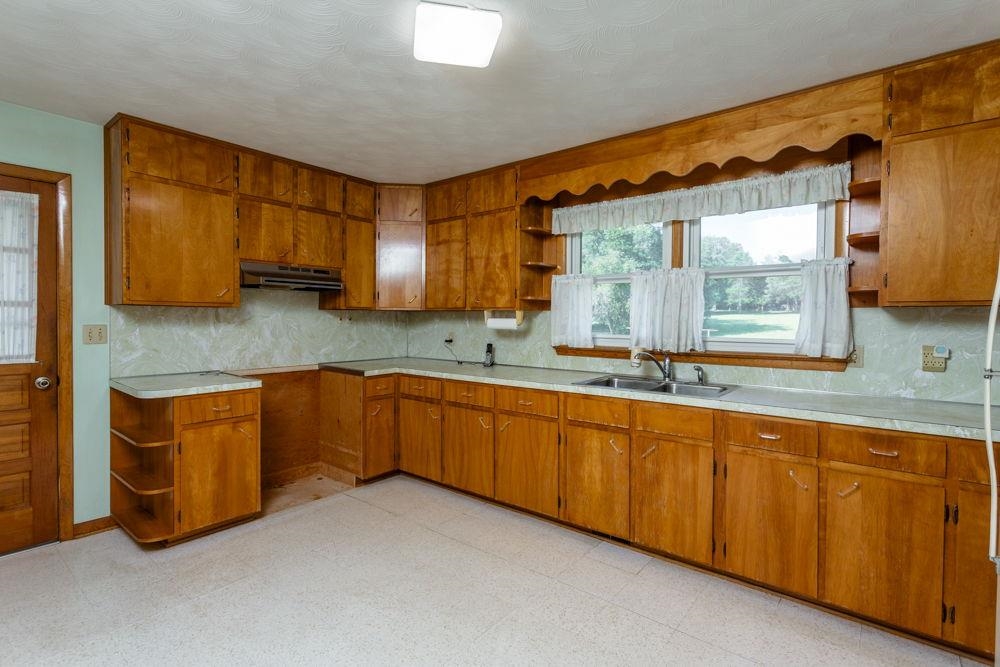 Northwest side with door to carport.