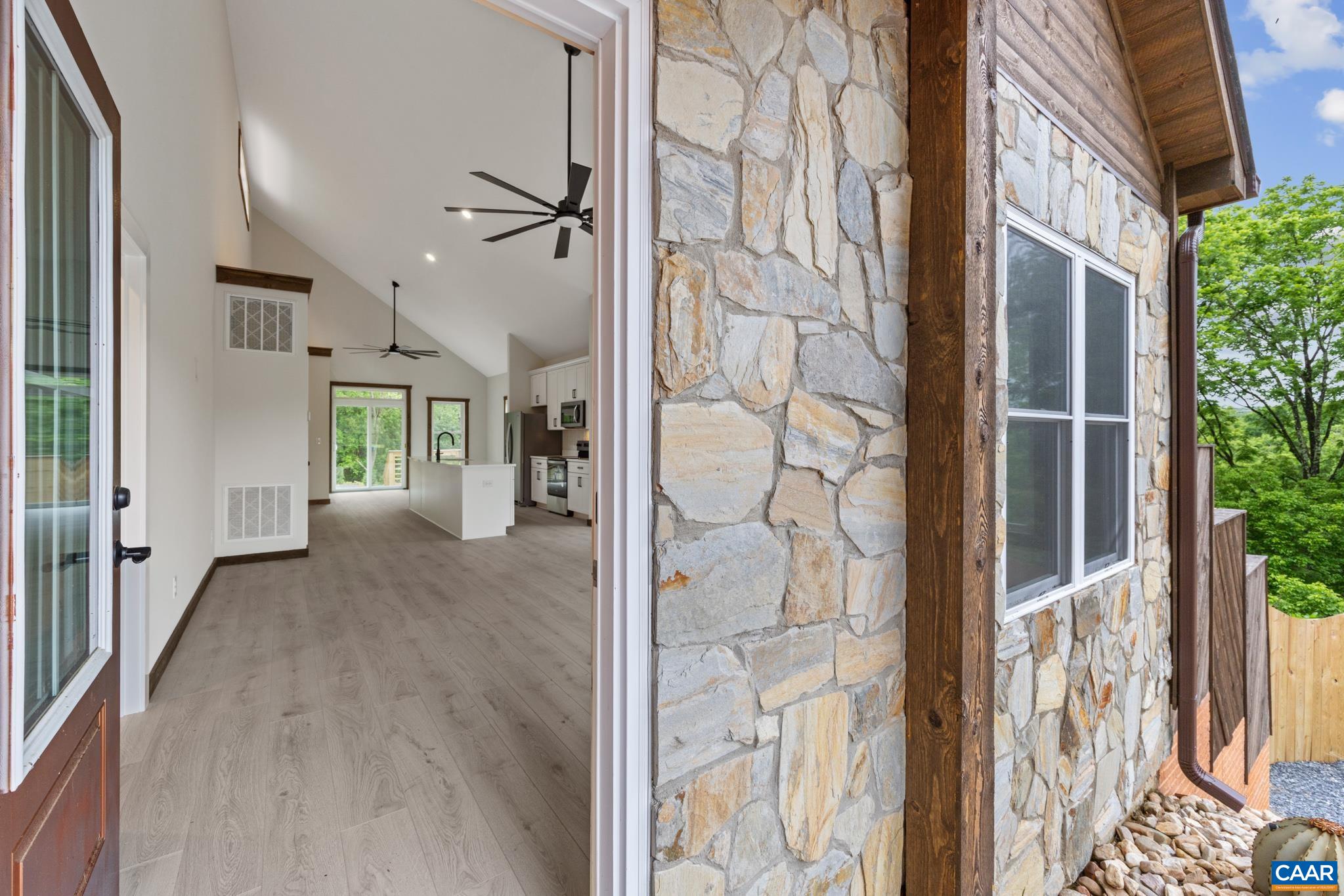 Stepping through the front door, the space opens up in to a quiet welcome. Seamless flooring, soft natural light spilling in from every window and the gentle rhythm of connected rooms.