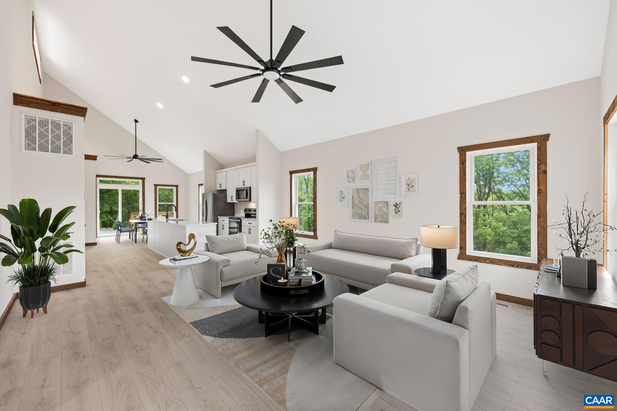 The living room opens up beneath soaring vaulted ceilings drawing your eyes upward. Natural light filled rooms. Effortless flow into the kitchen where an enormous island to keep the conversation moving between spaces. Making every meal feel shared.