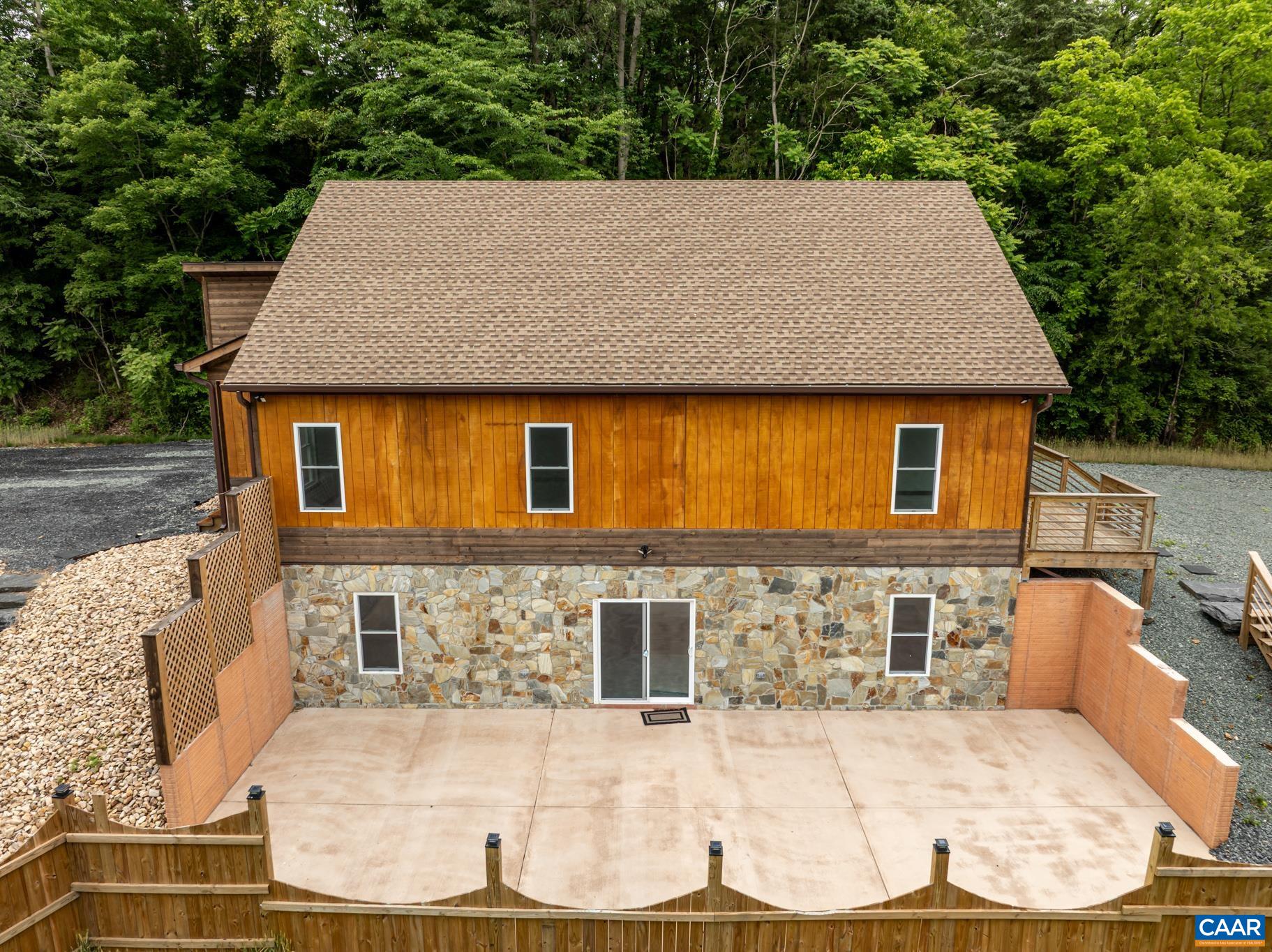 This home offers endless possibilities with the full walk out basement. Ideal for a man cave, home office or entertainment space. With direct access thru the sliding glass doors to the side yard with winter views of the Rivanna River.