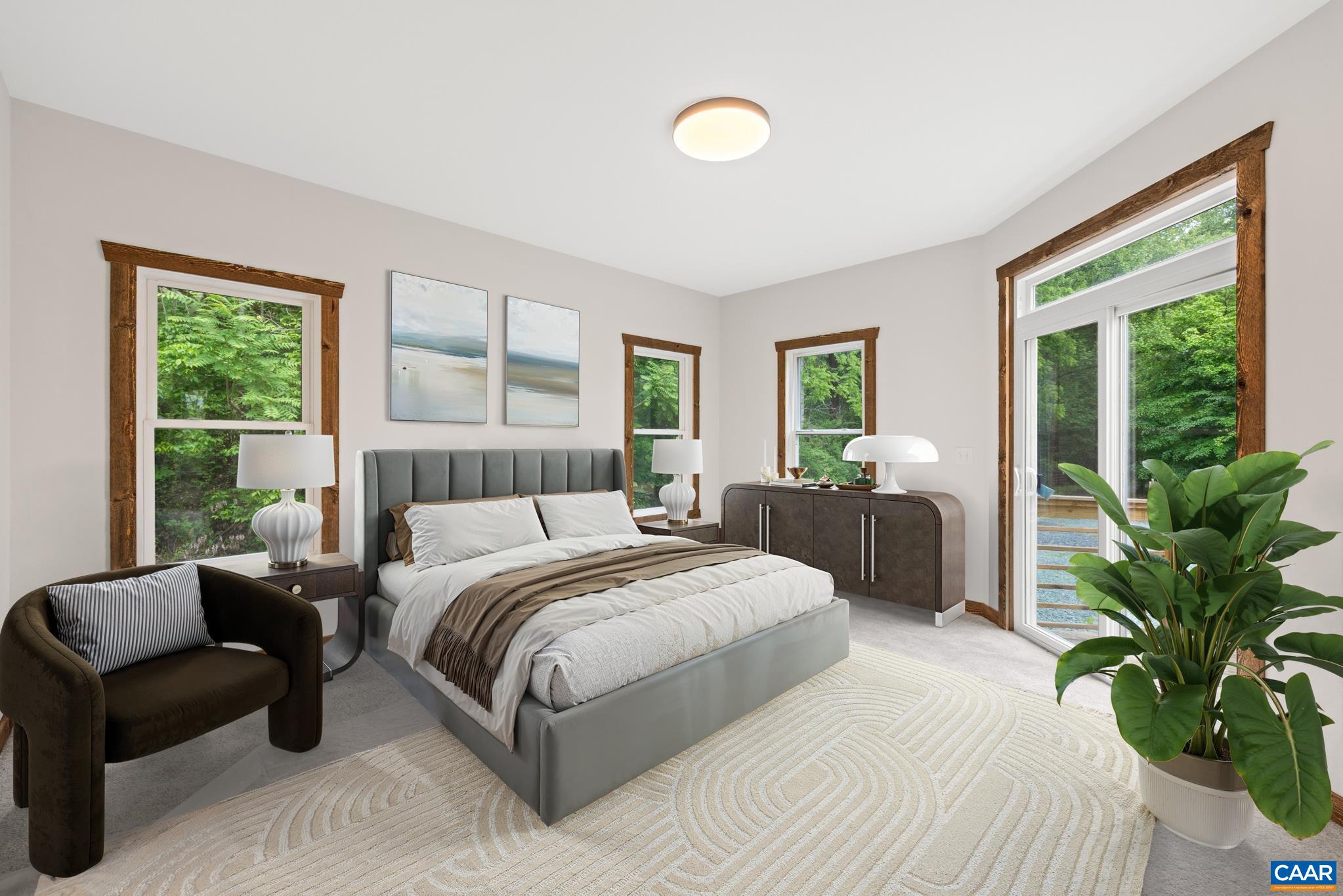 This serene retreat, bathed in natural light with expansive windows that frames the surrounding landscape. The glass door leads directly onto the deck blurring the line between indoors and out-perfect for morning coffee or quiet evenings under the stars.