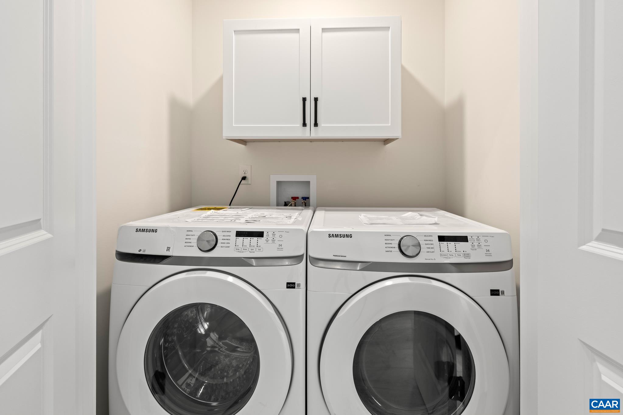 This fully equipped laundry includes the washer and dryer, ample storage. Offering convenience and functionality in this 1st floor dedicated space.