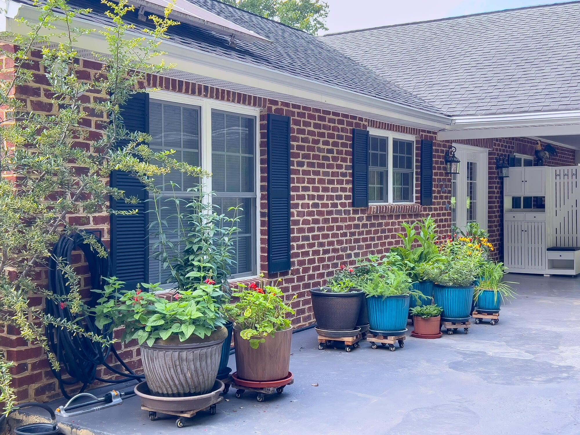 Flowers grace the carport.