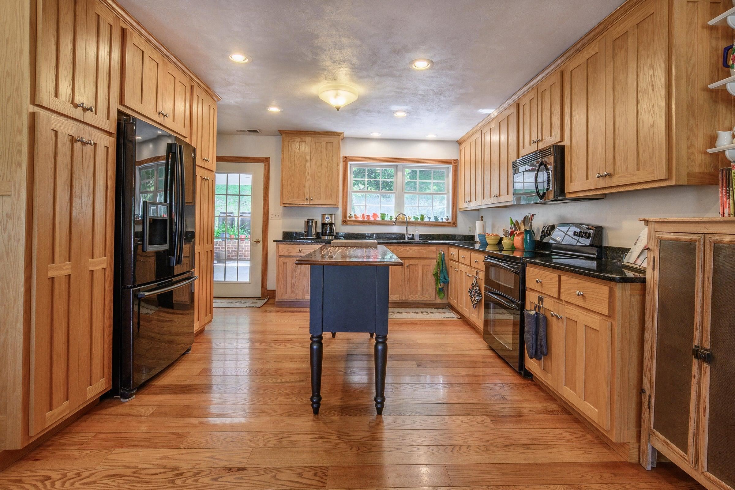 Enter the kitchen from the door leading to the covered carport.