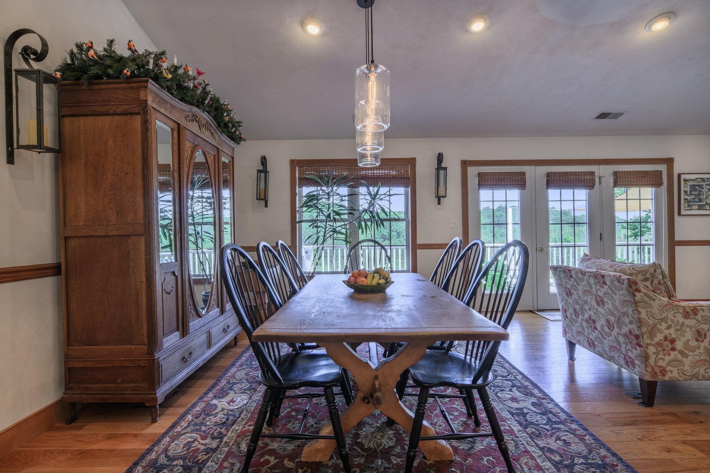 From the dining area, doors lead out to the balcony/deck.