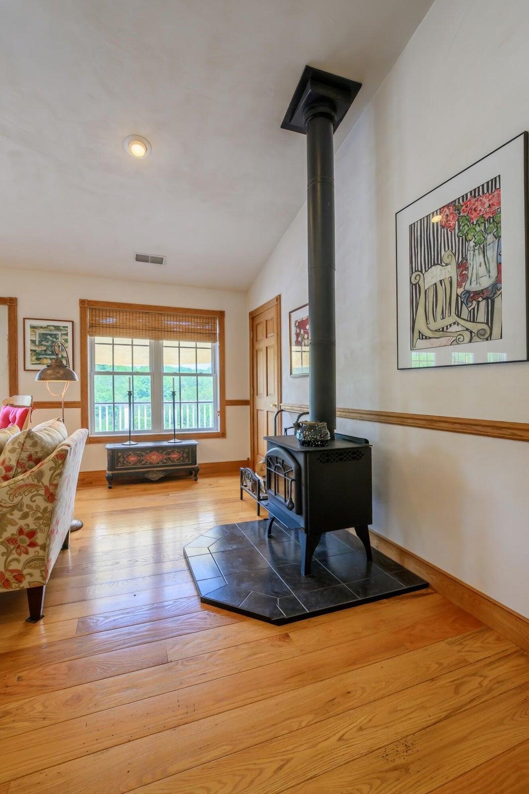 Cozy warmth from the wood stove in winter. There is plenty of wood on the property.