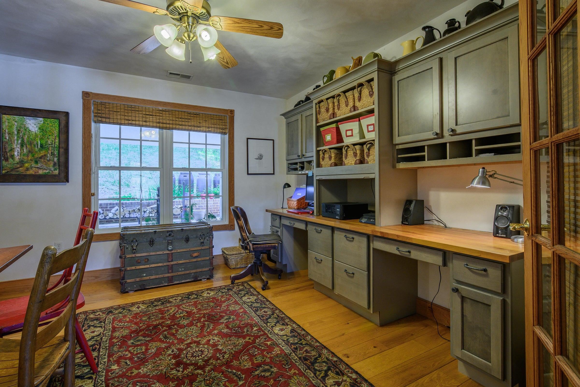 Built-in desk, book cases and drawers.