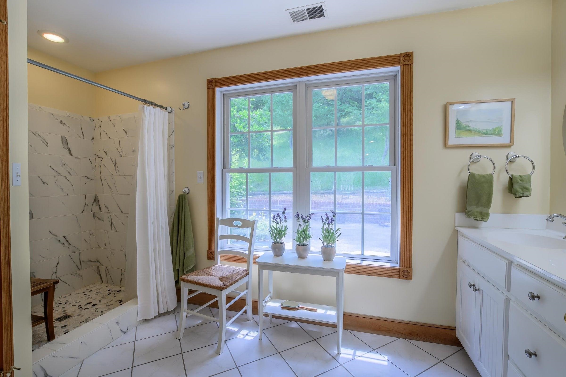 Spacious well-lighted bathroom. The shower has been upgraded.