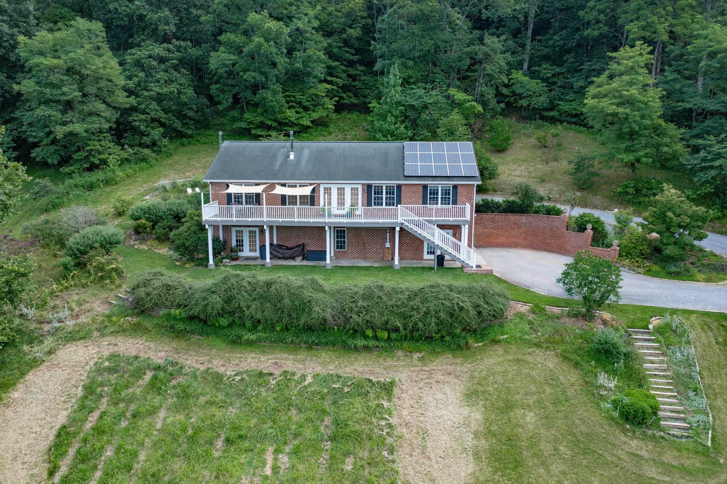 Aerial of House  View of the house from above. Notice the stairs leading to the lower garden.