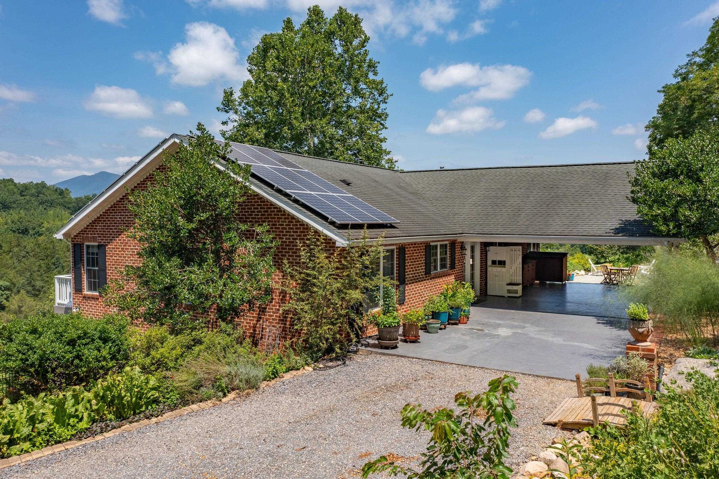 The carport becomes a shady recreation area, featuring views of Hog Back Mtn.