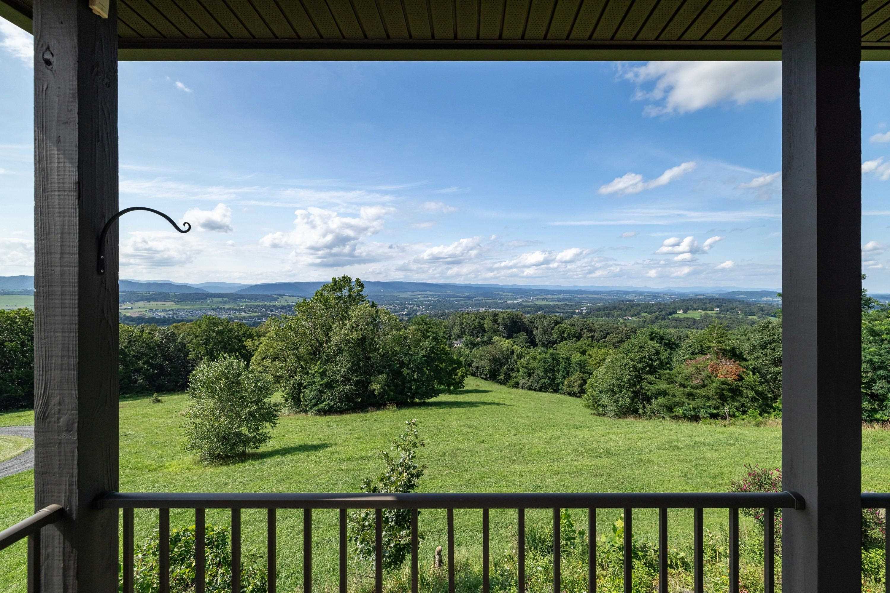 The spacious front porch allows a covered area for overlooking the beautiful views the home offers.  This porch features composite building materials, and is large enough for a table and chairs set.