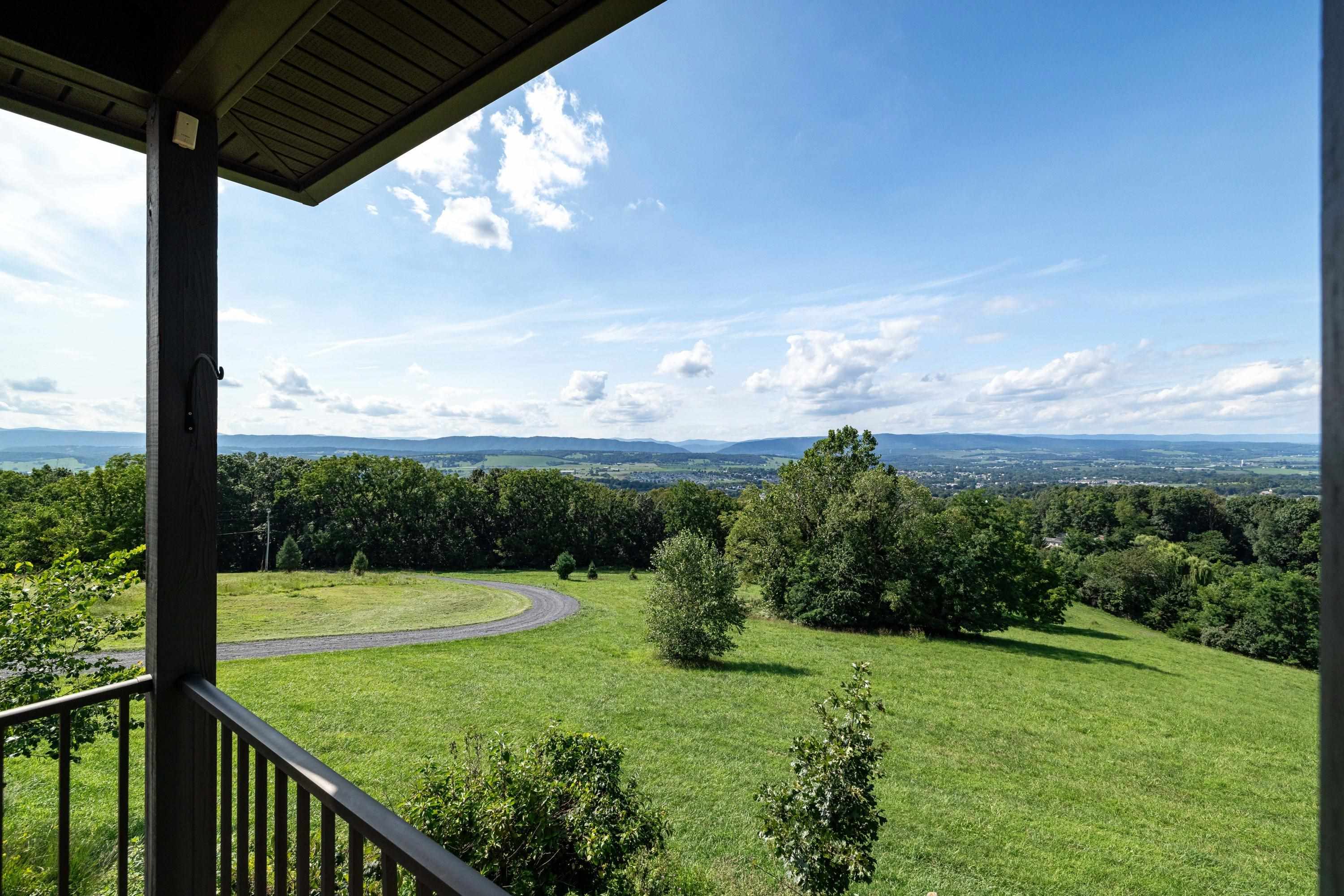 The spacious front porch allows a covered area for overlooking the beautiful views the home offers.  This porch features composite building materials, and is large enough for a table and chairs set.