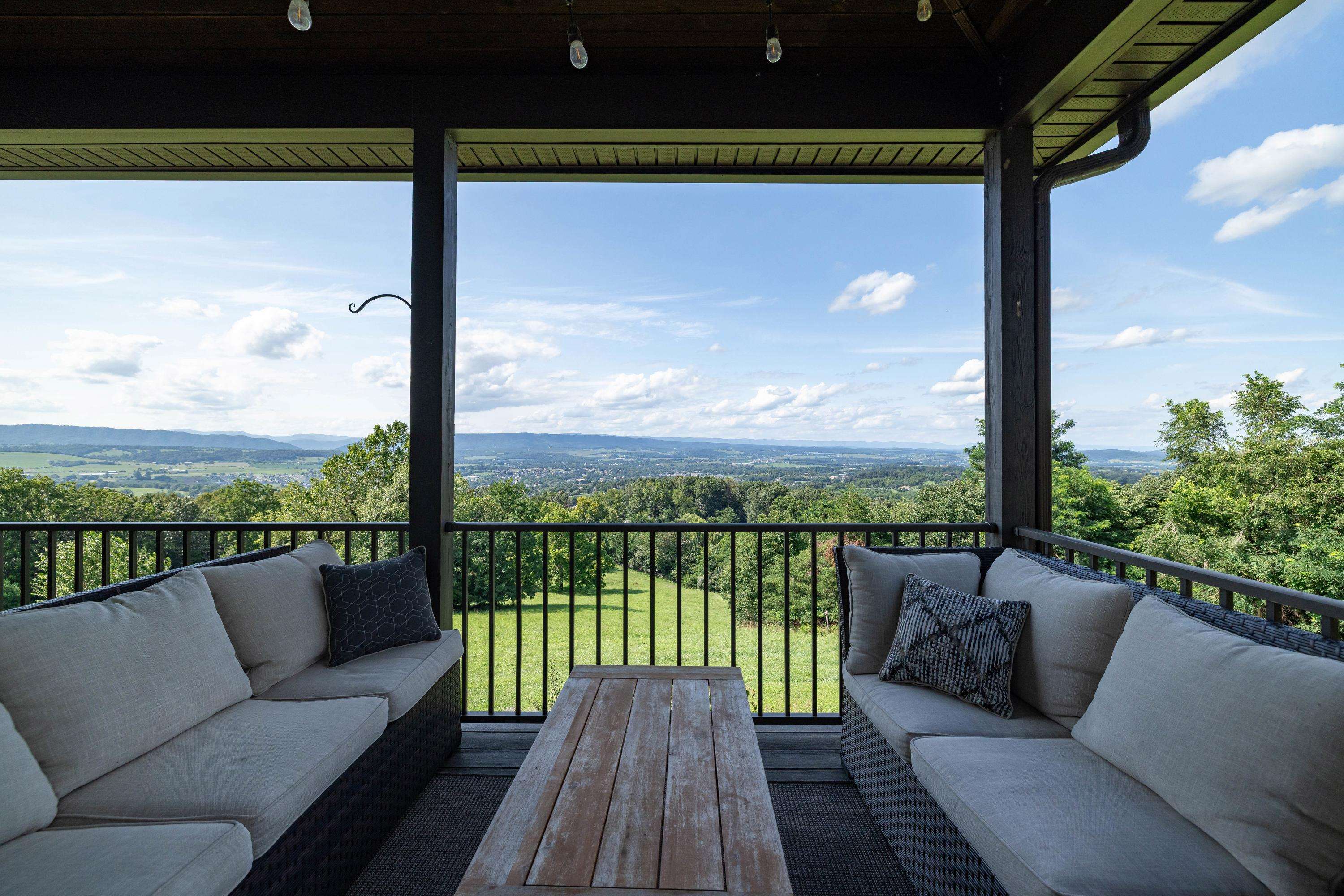 The spacious front porch allows a covered area for overlooking the beautiful views the home offers.  This porch features composite building materials, and is large enough for a table and chairs set.