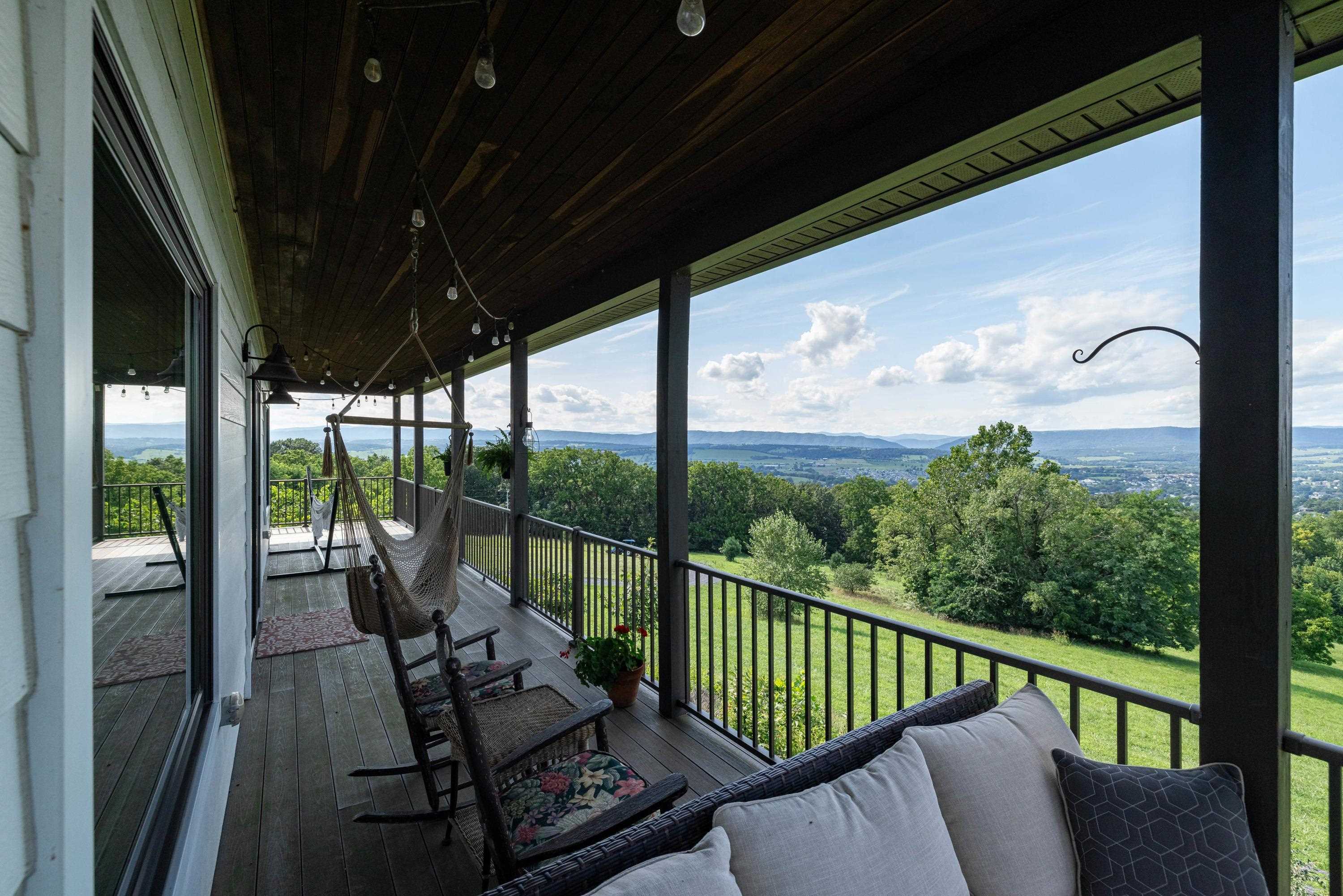 The spacious front porch allows a covered area for overlooking the beautiful views the home offers.  This porch features composite building materials, and is large enough for a table and chairs set.