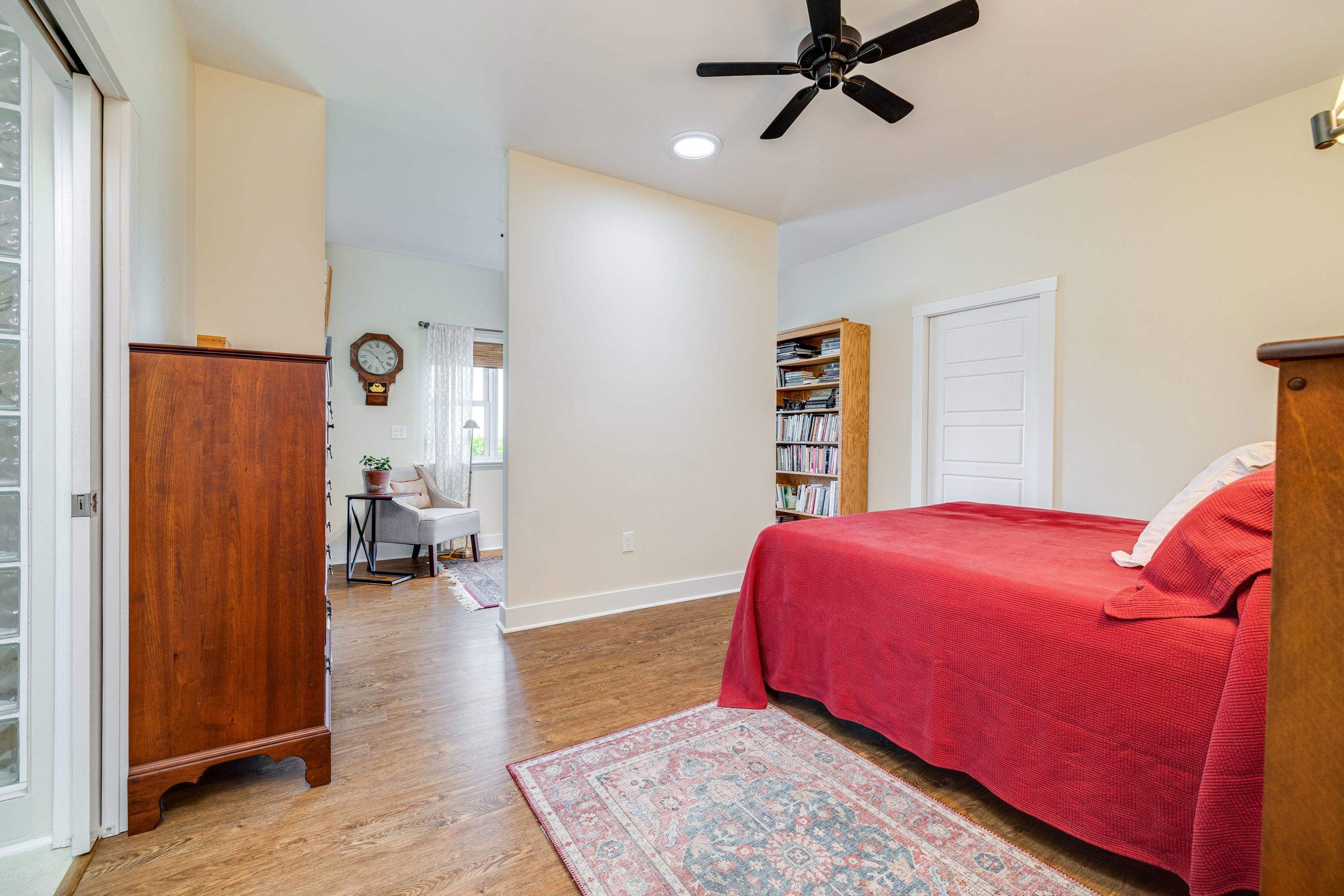 The primary bedroom offers space for a sitting area, walk-in closet, attached full bathroom, large windows, and much more!