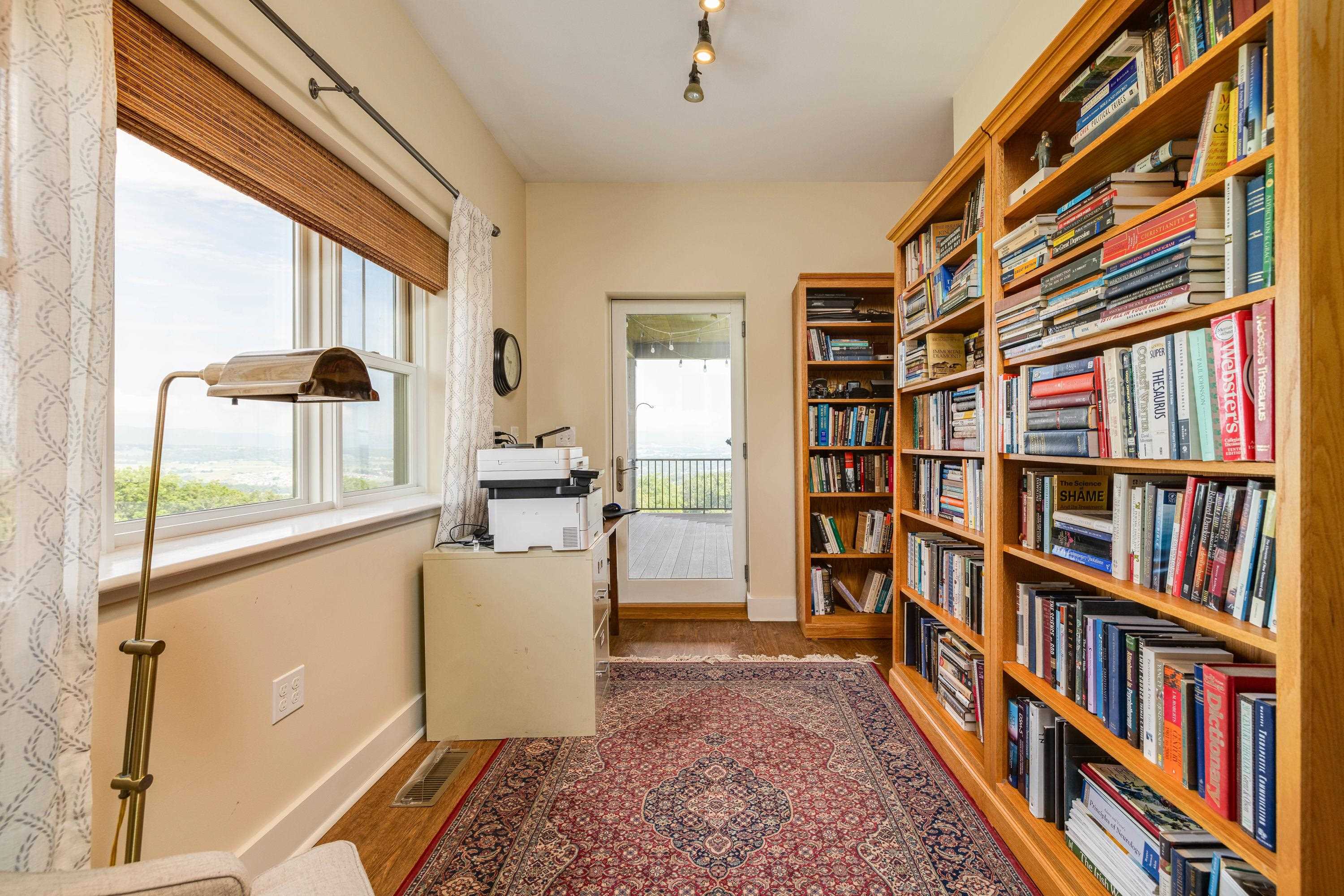 The primary bedroom offers space for a sitting area, walk-in closet, attached full bathroom, large windows, and much more!