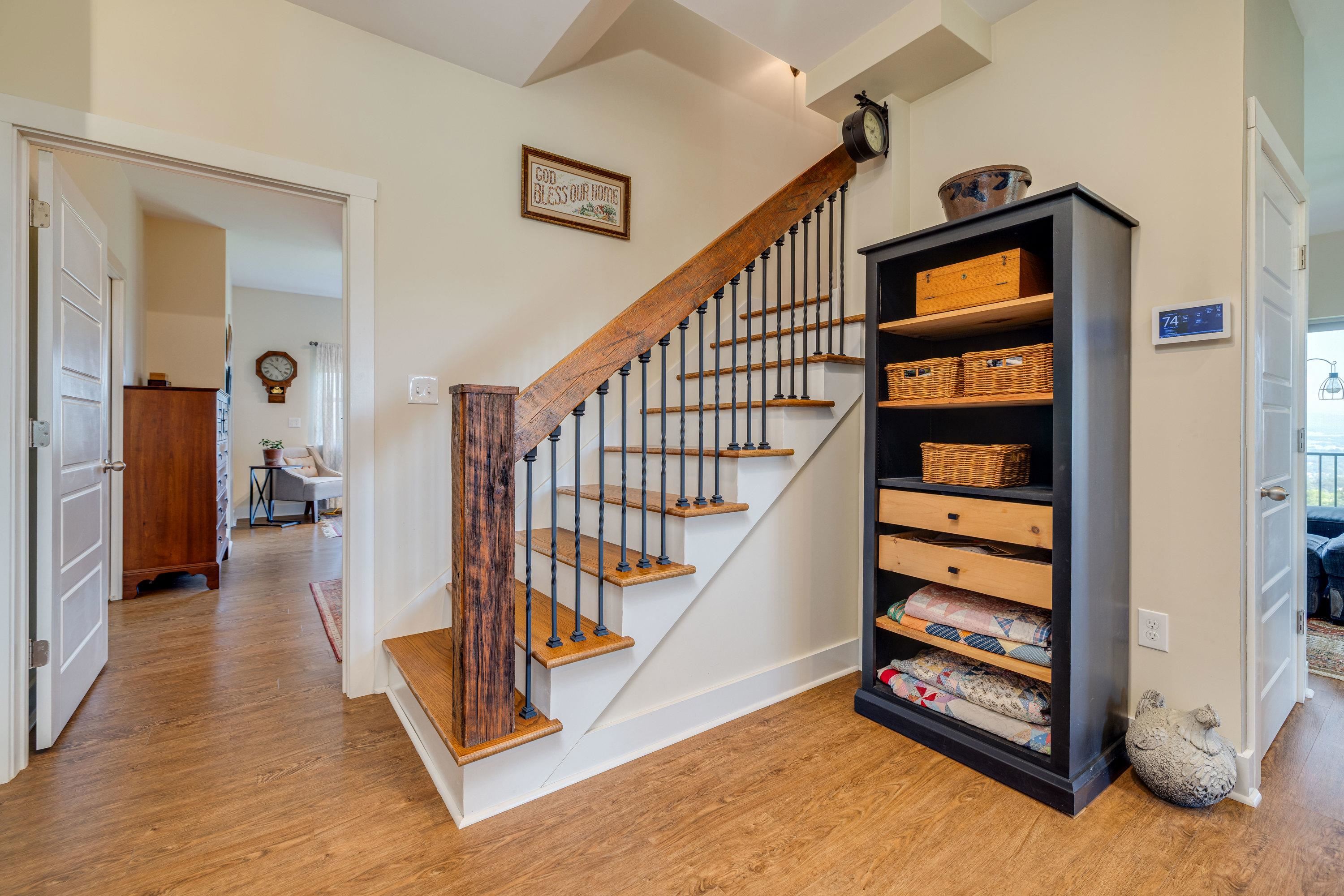 The hardwood staircase offers convenience to the upper bedrooms.