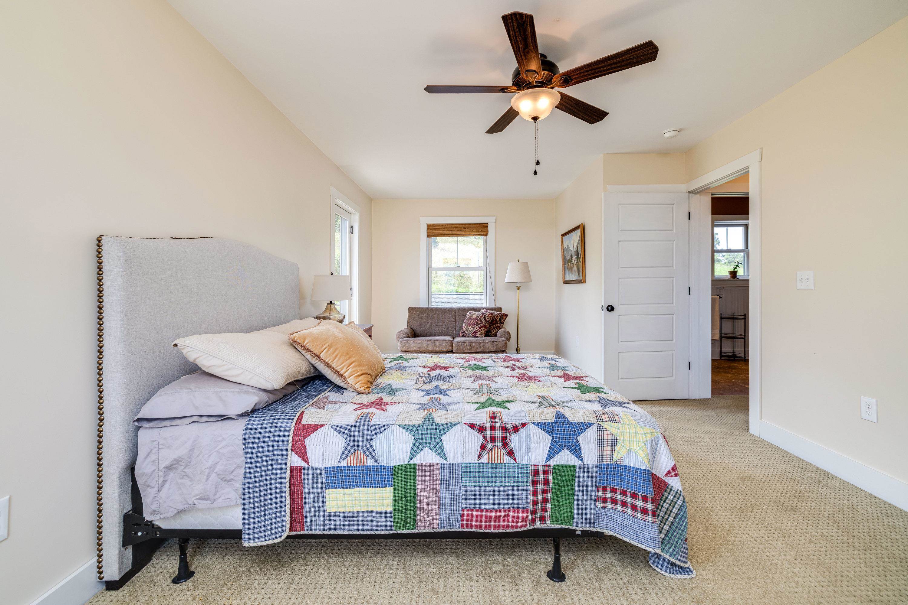 This third bedroom is on the upper level of the home and features comfortable flooring throughout, ceiling fan, large closet, and much more!