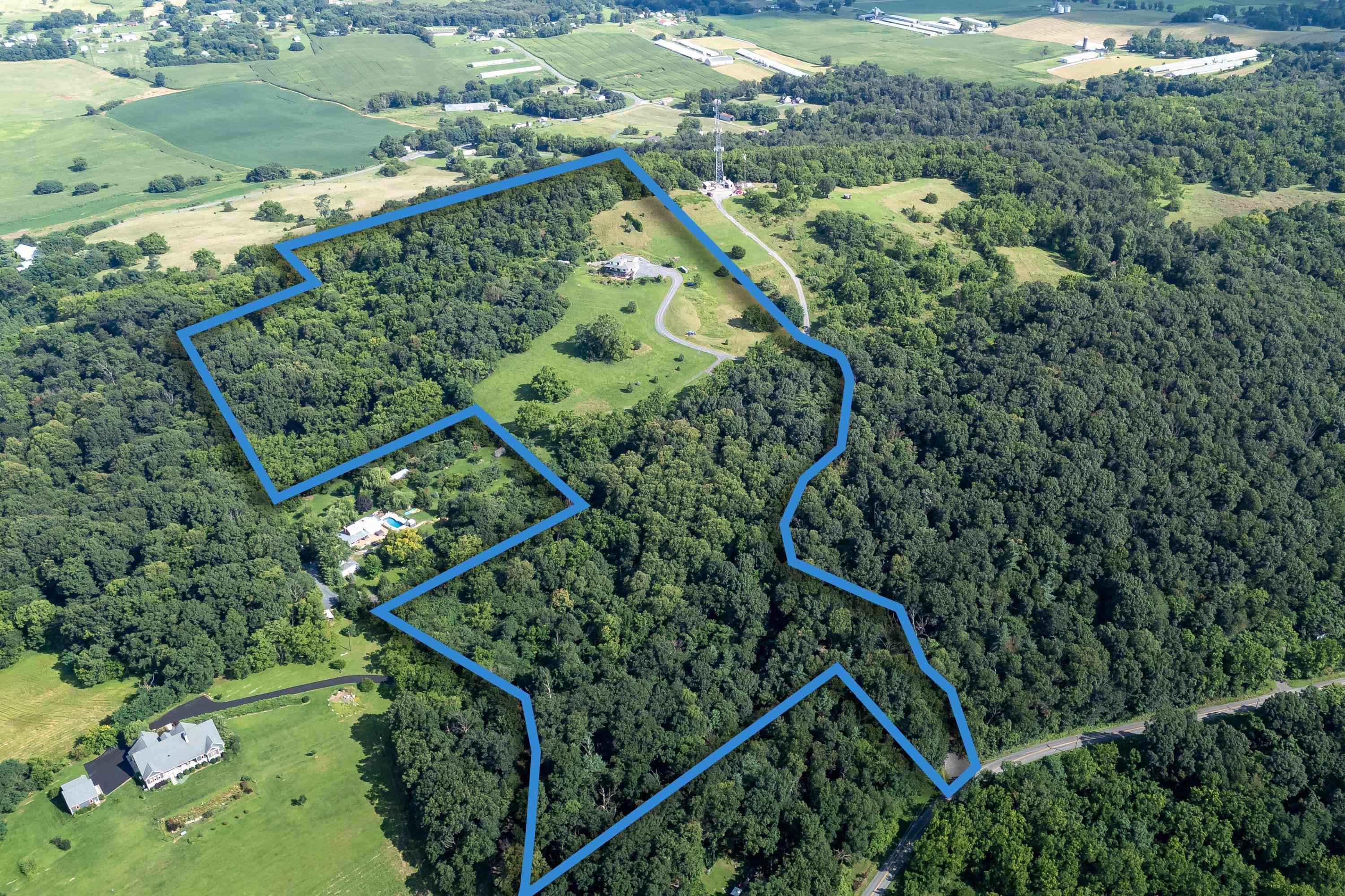 The 26 acre lot includes some wooded areas offering a great degree of privacy to the residence.