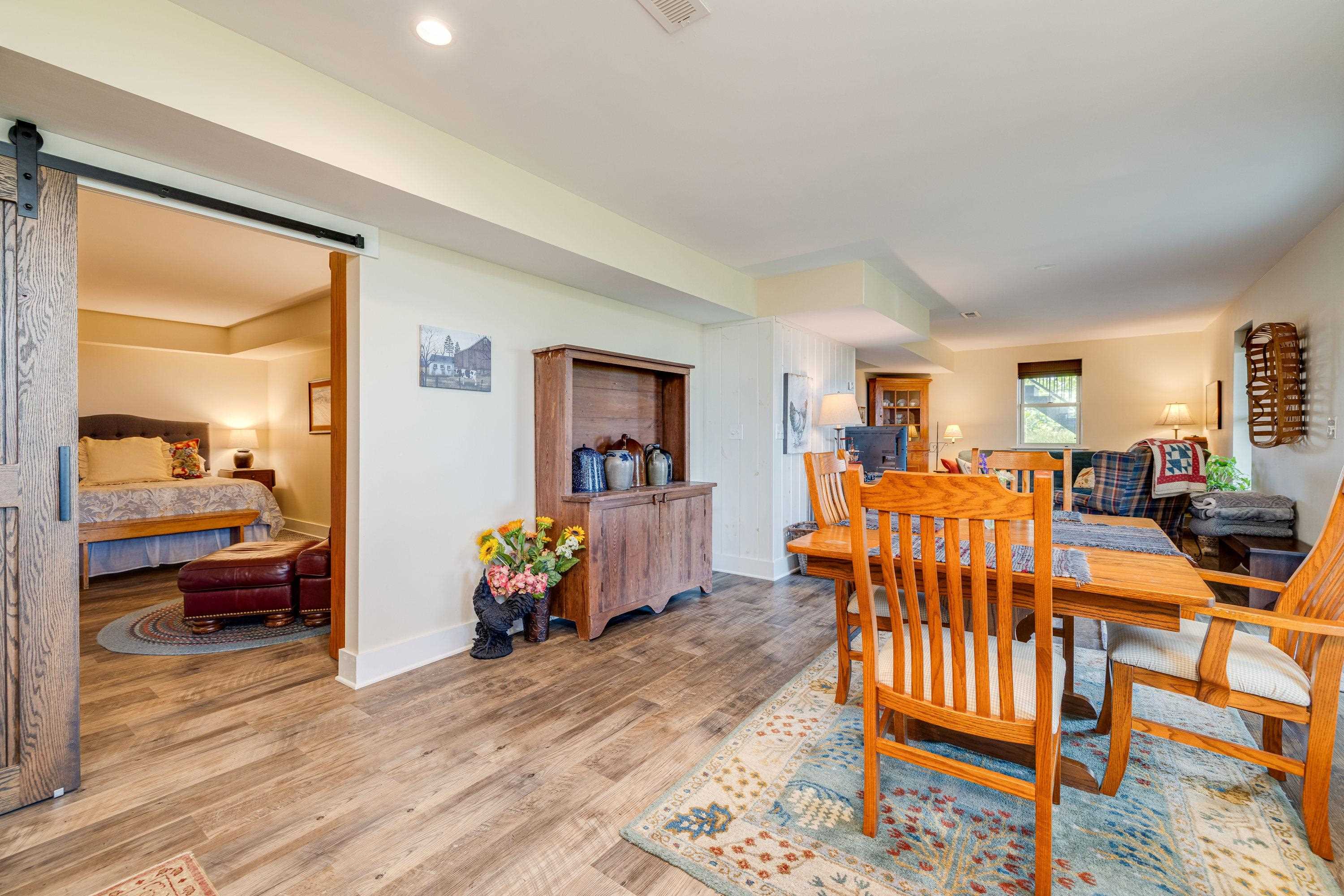 This open concept space features an easy flow from the living room, dining area, and kitchen space.  The bedroom is located off this large area as well!