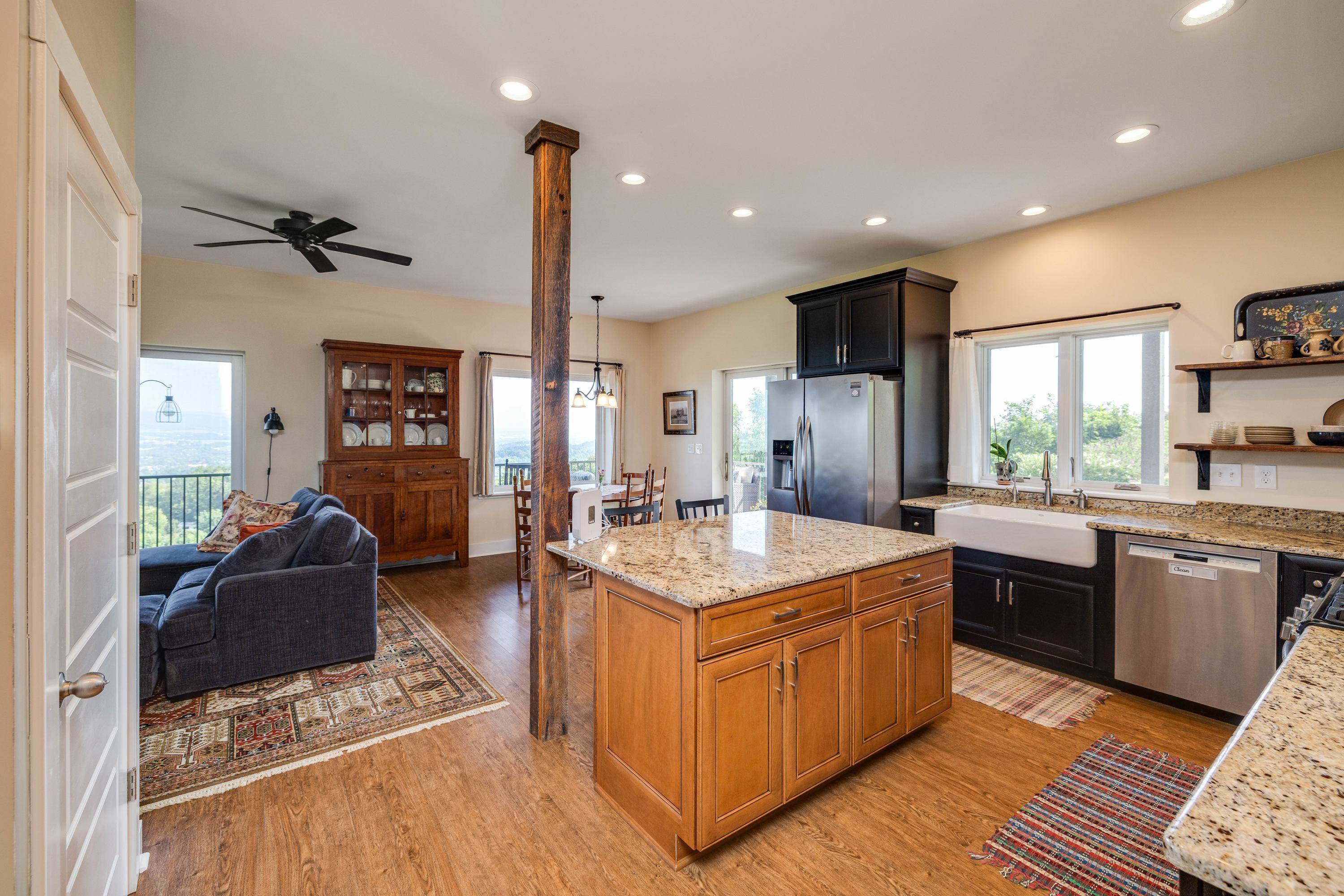 The kitchen features hardwood flooring throughout the space.  Wooden cabinetry, granite counter-tops, recessed lighting, eat-up island area, stainless steel appliances, and much more!