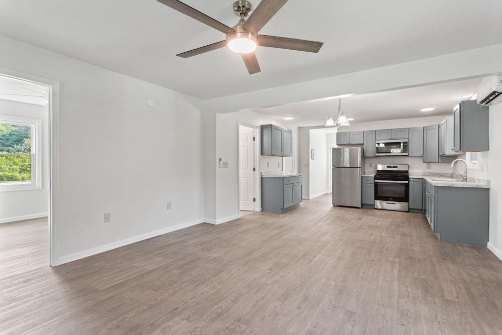 looking from living area into the dining and kitchen with a coffee center!