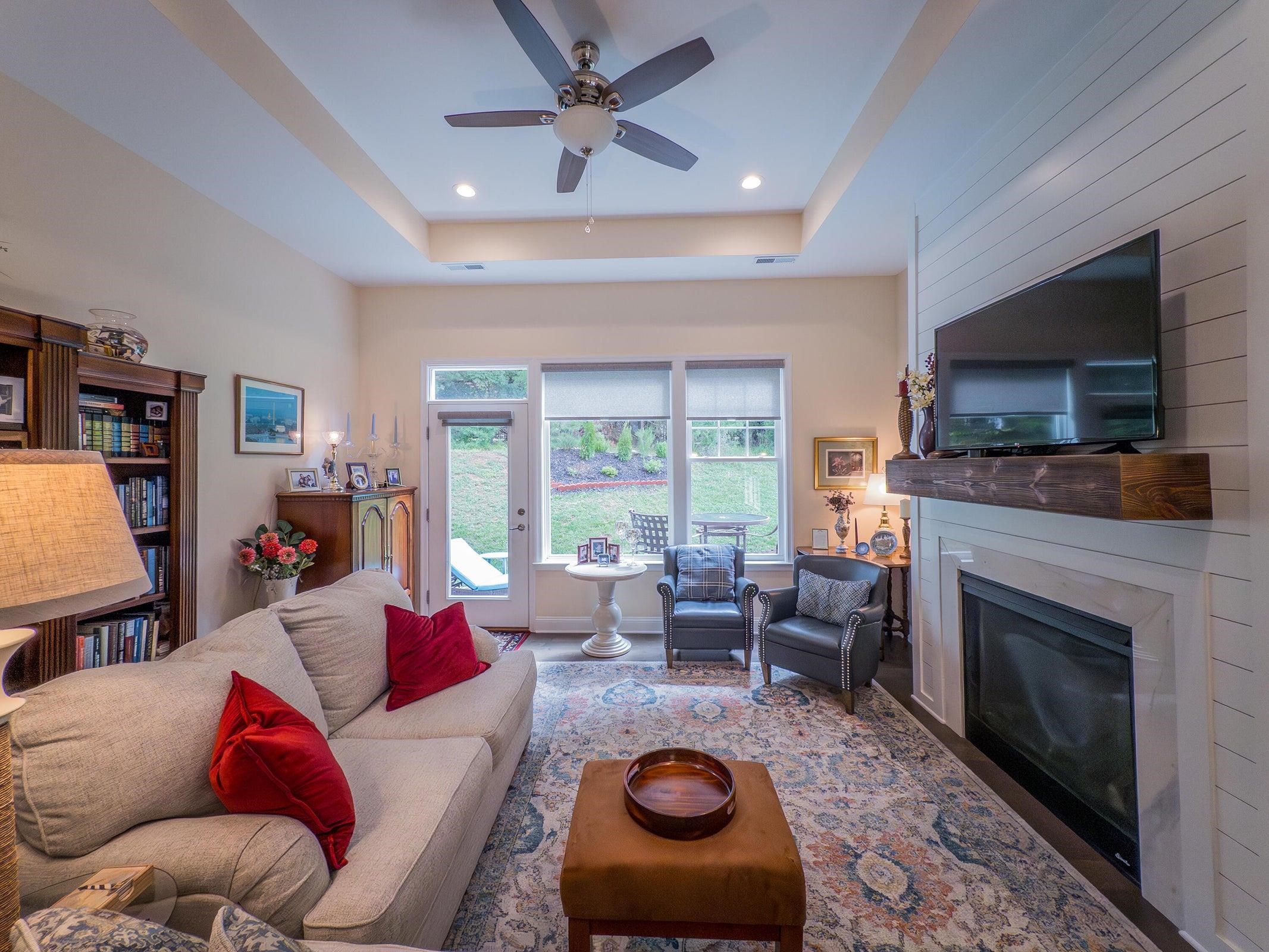 Curl up on your sofa before the gas log fireplace.