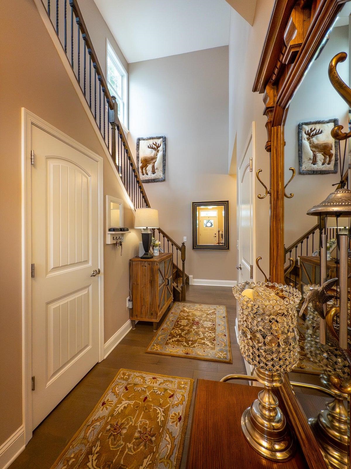 Door enters the hall from the garage.