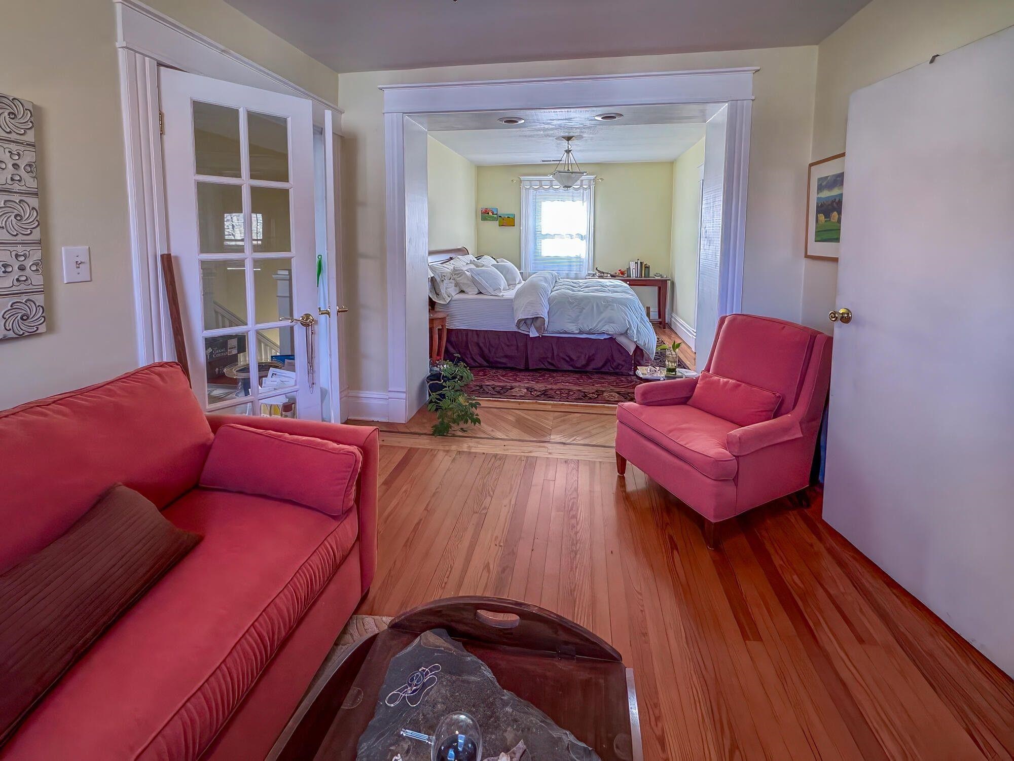 Bedroom #1. Renovated expansive Master suite with French entry doors, complete with a full bathroom, spacious sitting area, large walk-in closet and cozy library nook with seasonal mountain views.