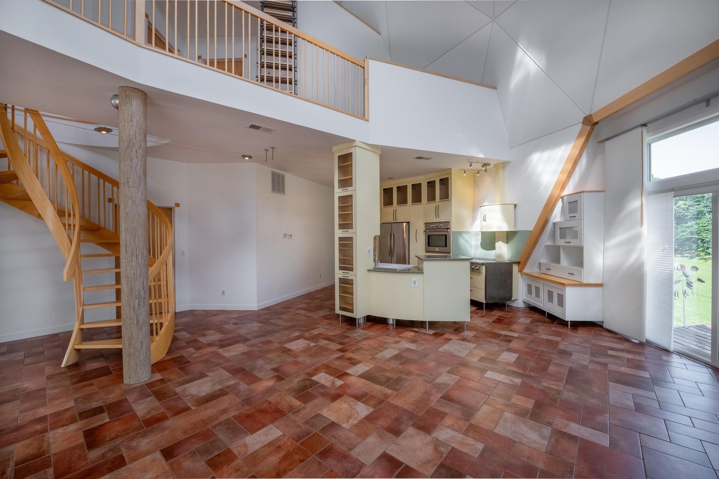 Second floor balcony opens above the kitchen.