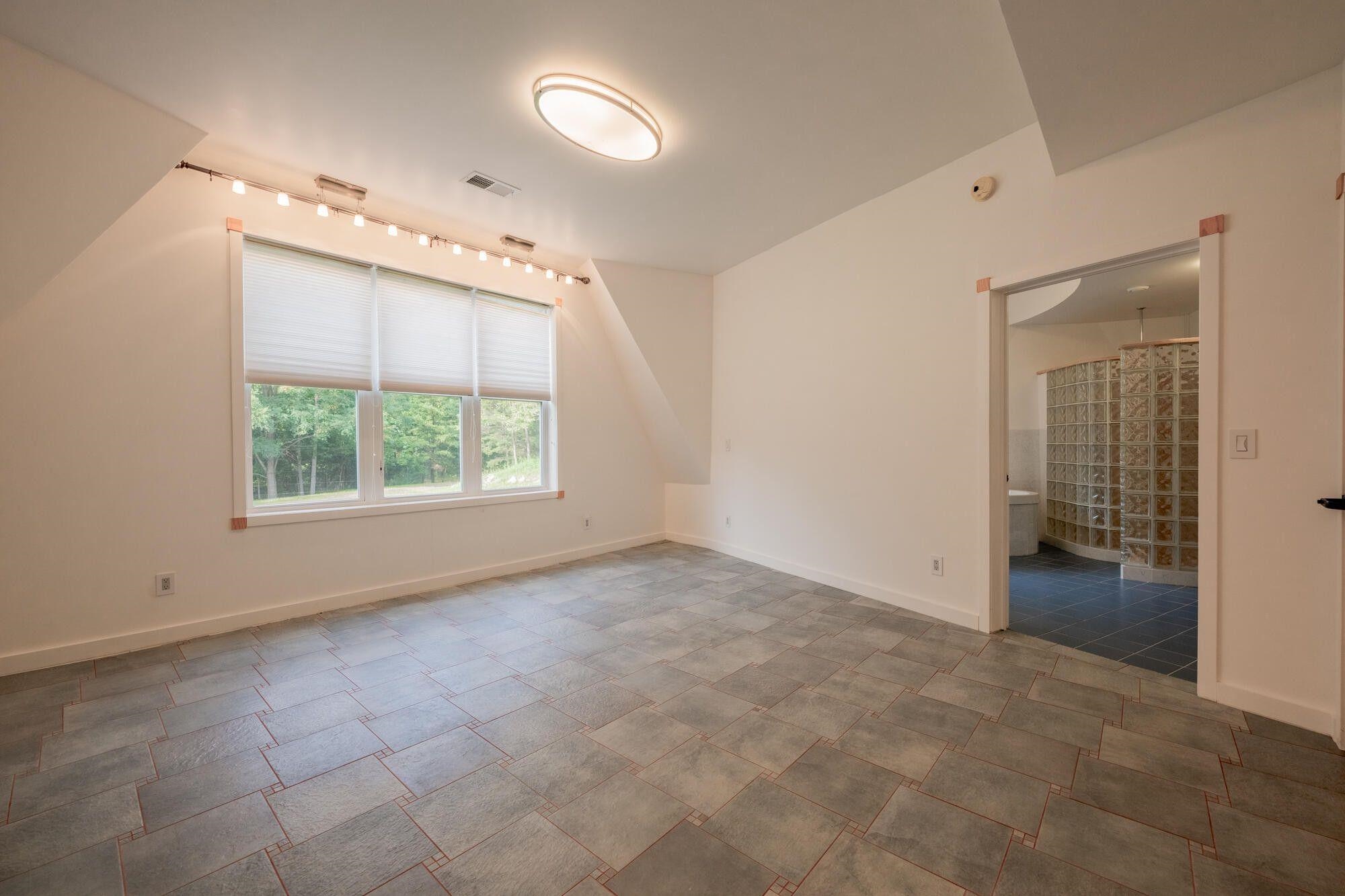 Primary Suite opens into a spacious Master Bath.