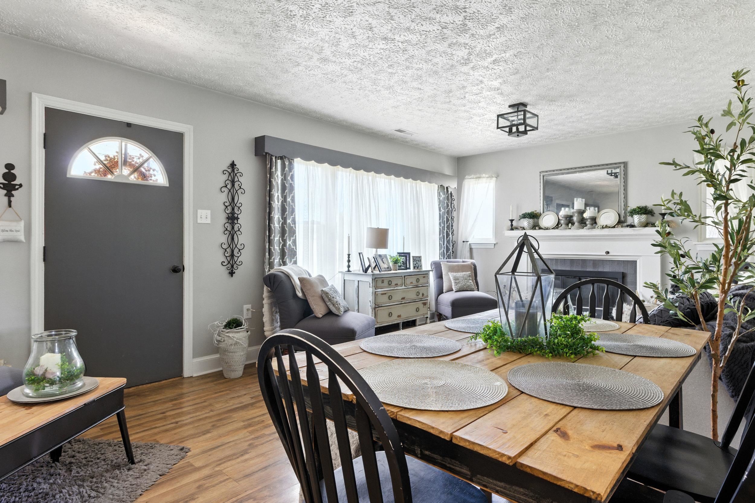 Living room has table space by the kitchen.