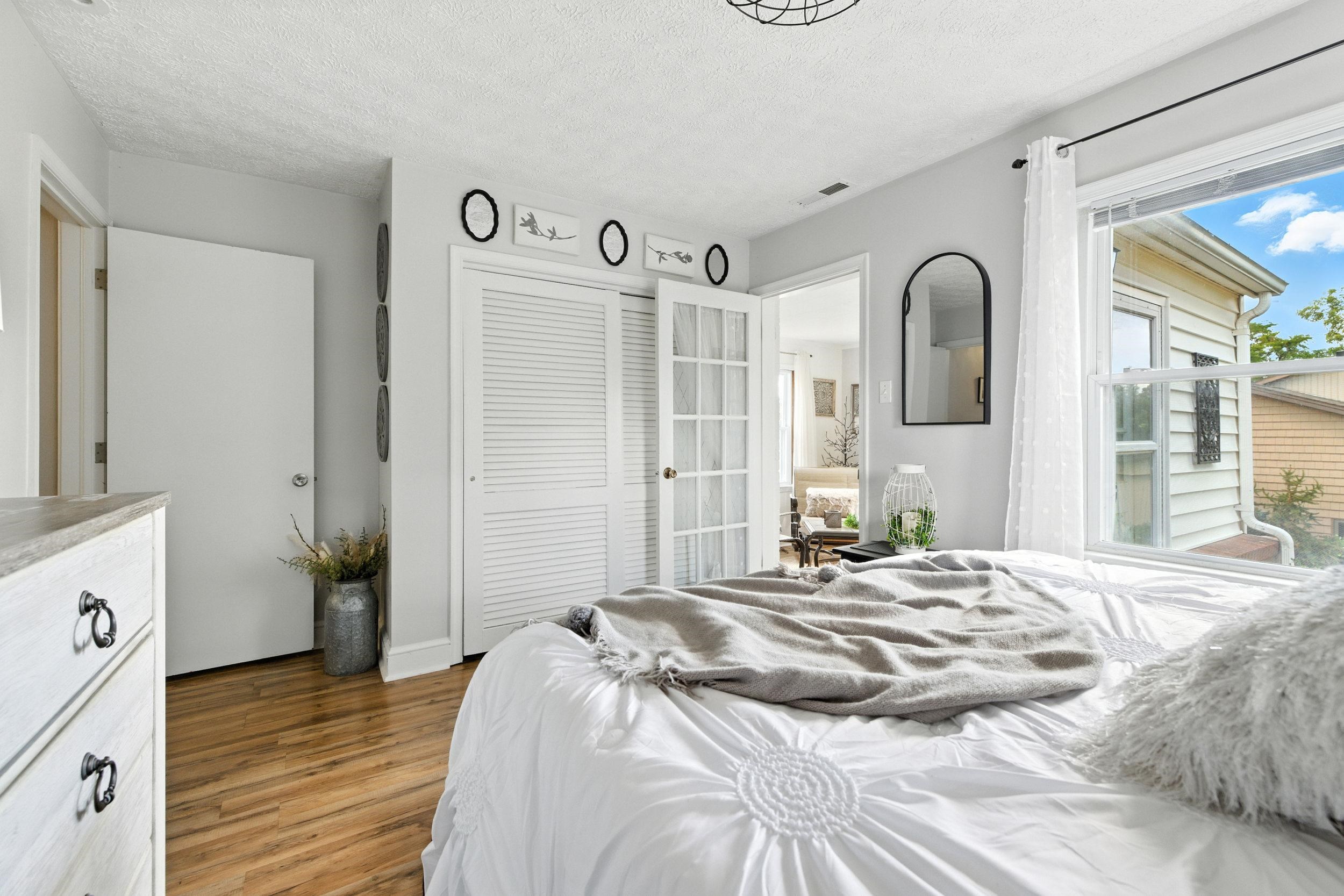 Primary BR with French door to the sunroom.
