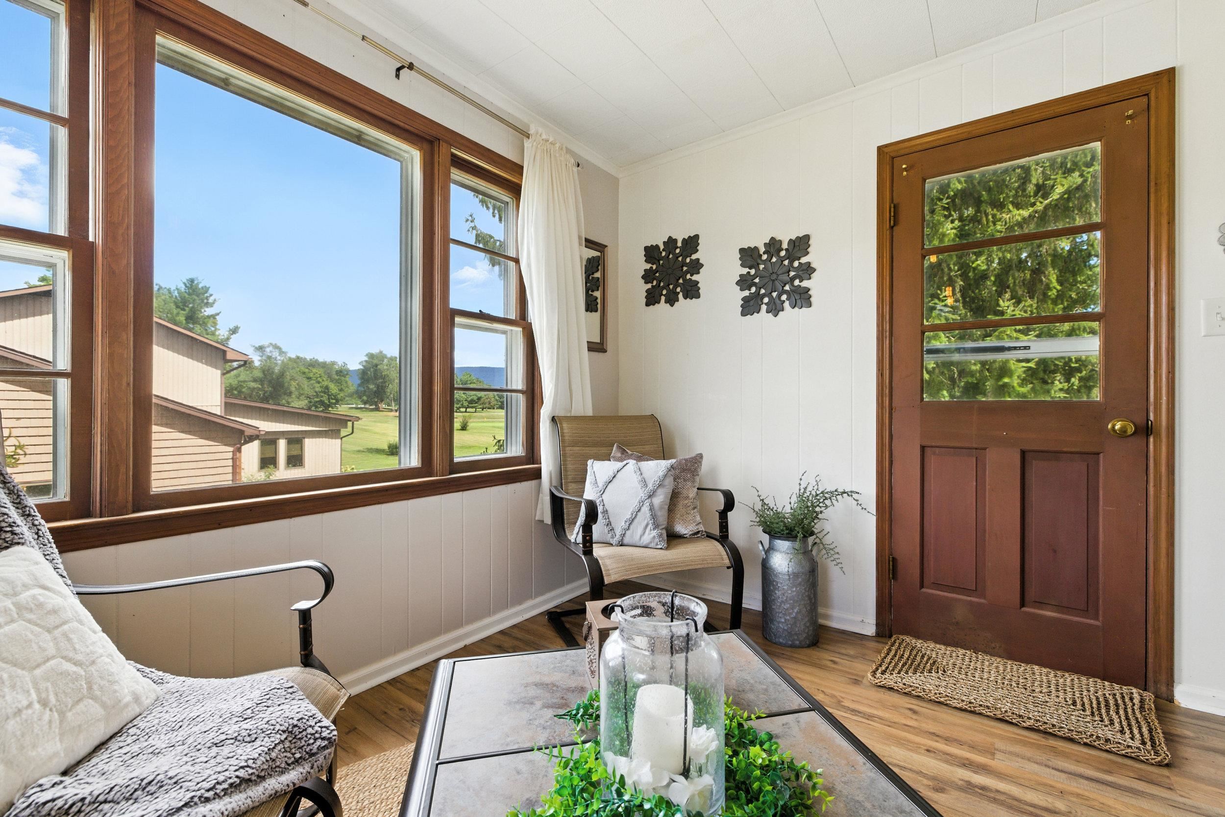 Backyard access door in sunroom.