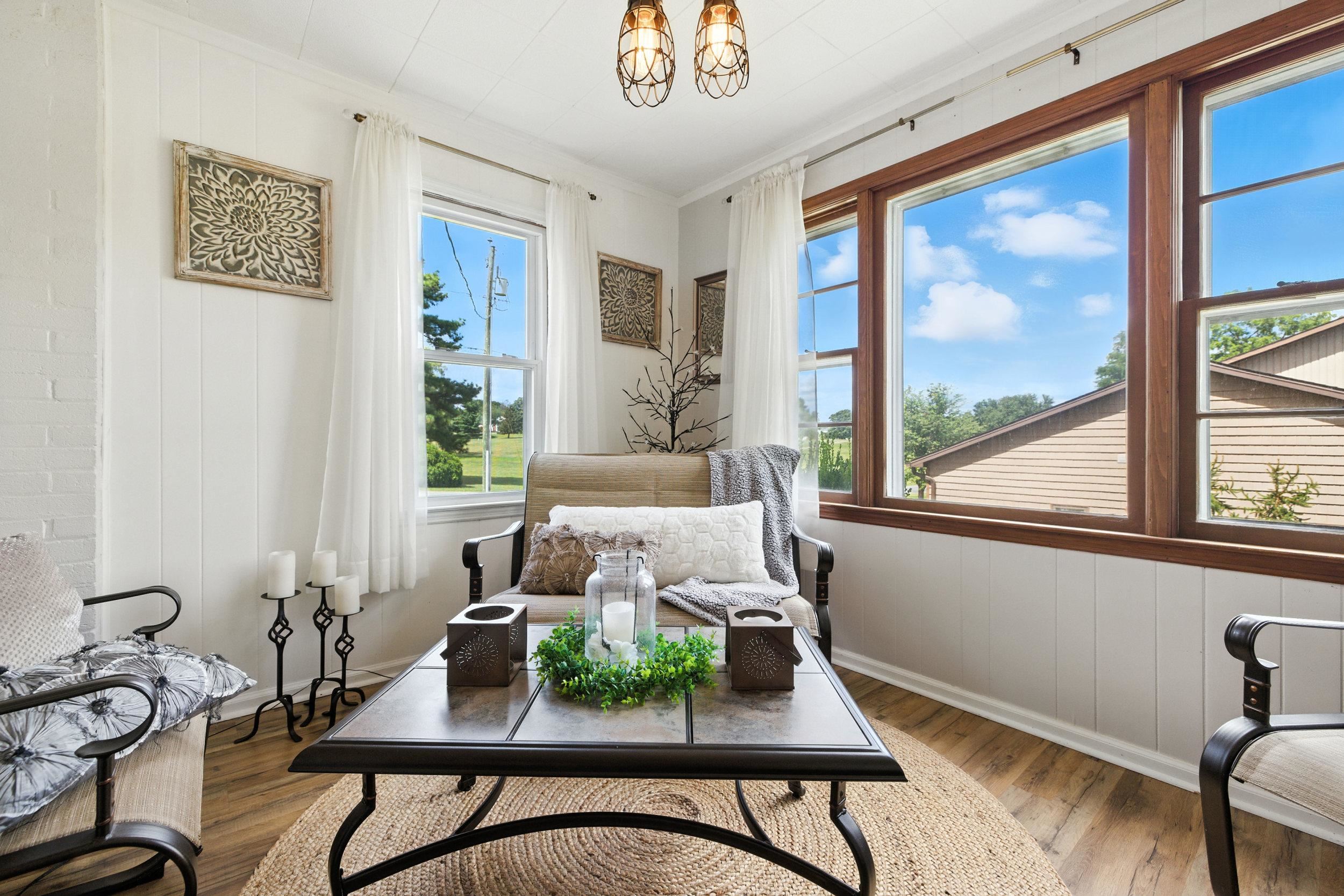 Enjoy sun & views in the sunroom!