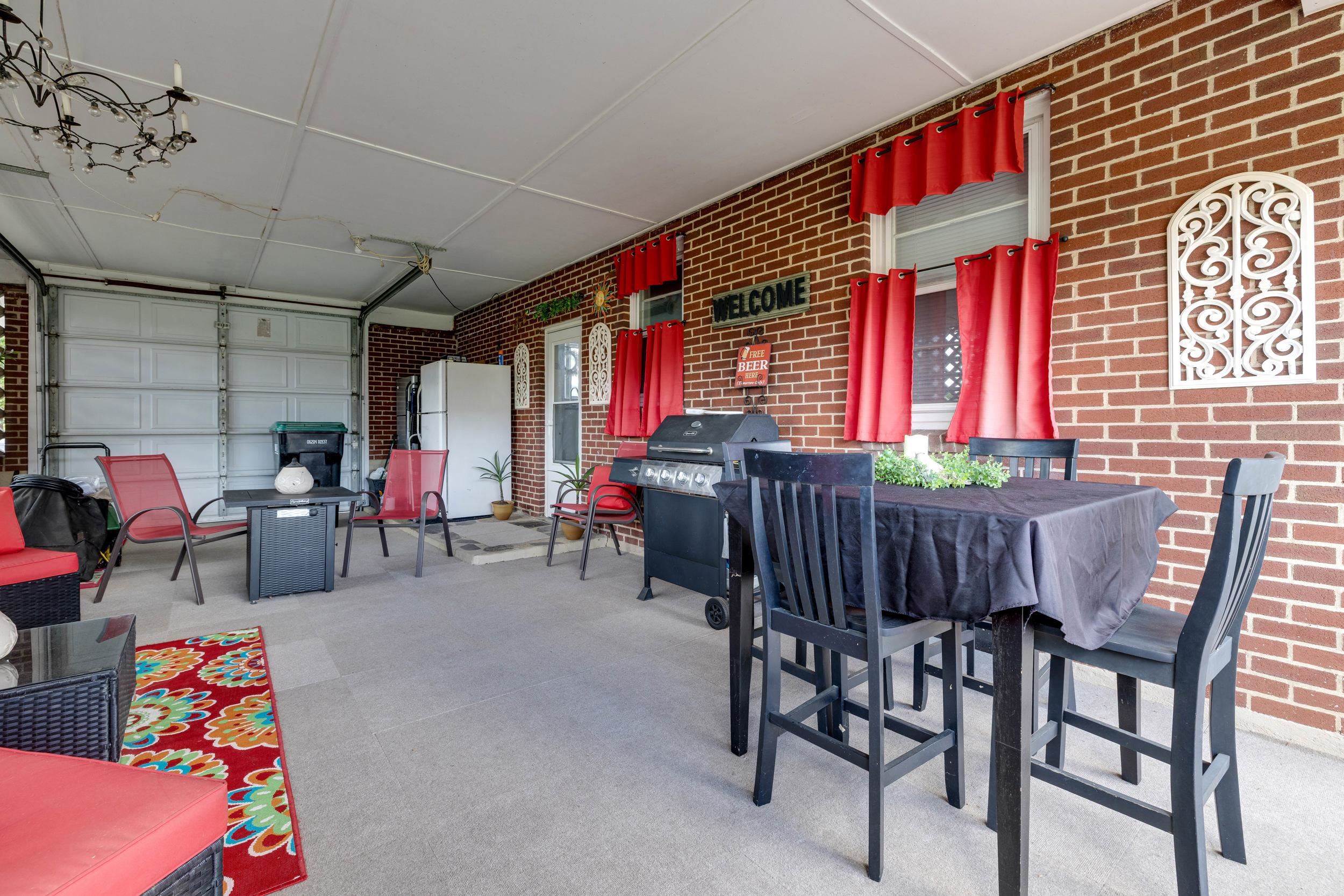 Single walled carport with manual garage door.