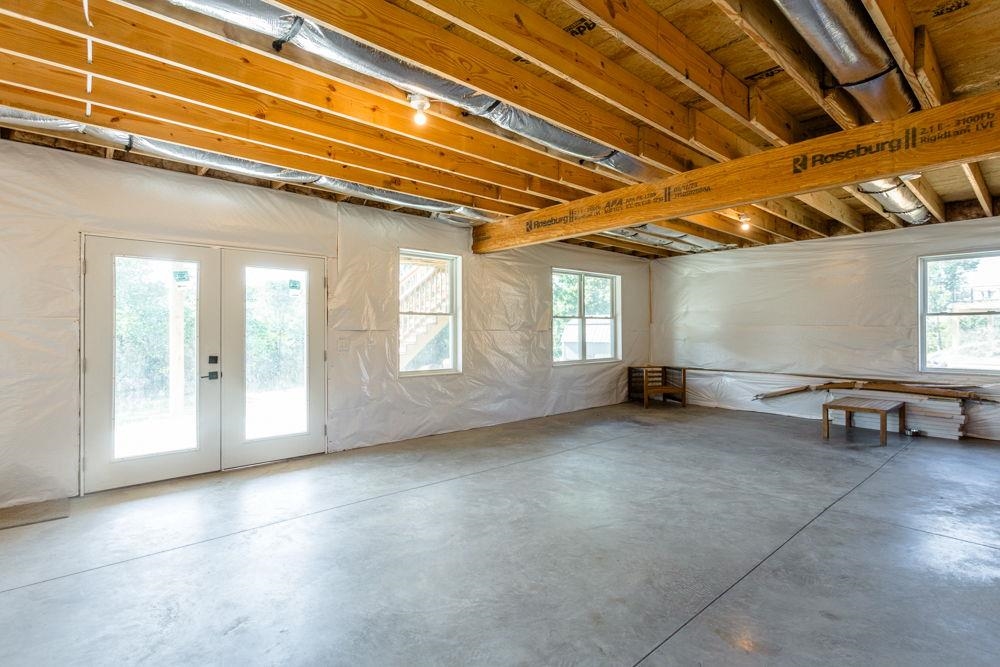in unfinished basement roughed in for bathroom.