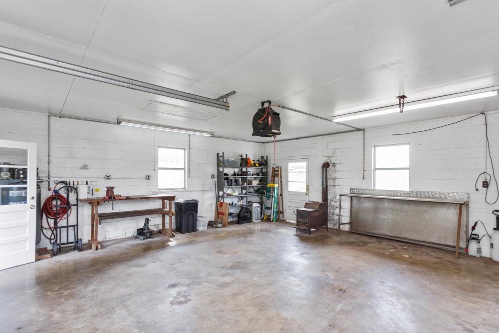 Attic storage and space for 2 cars. Great for workshop too! All conveys - SOLD AS IS