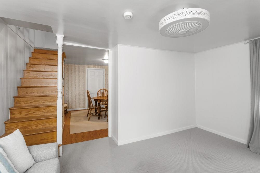 with stairs up and dining between owner's and living room.  Front part of house.