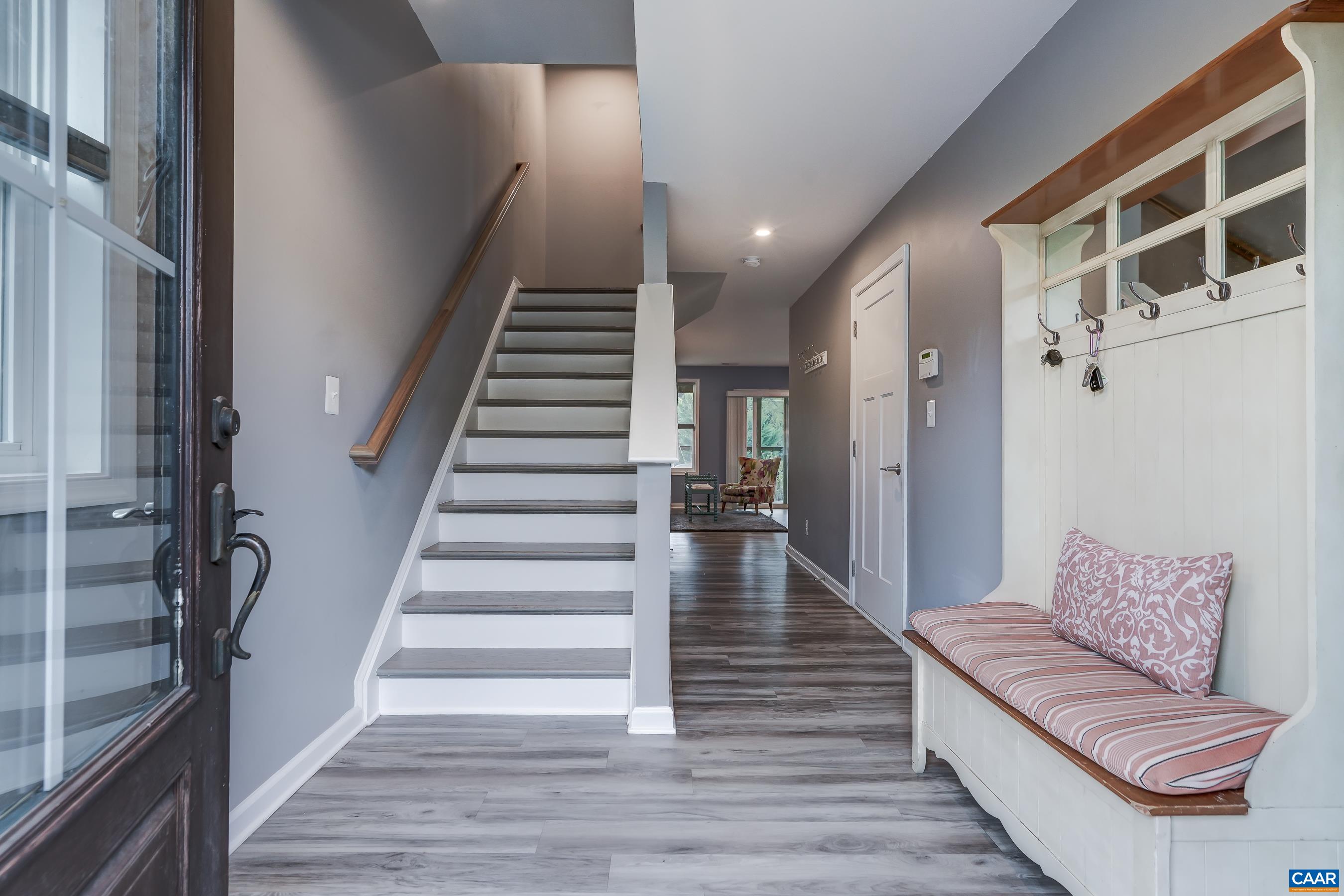 Foyer with luxury vinyl plank flooring.