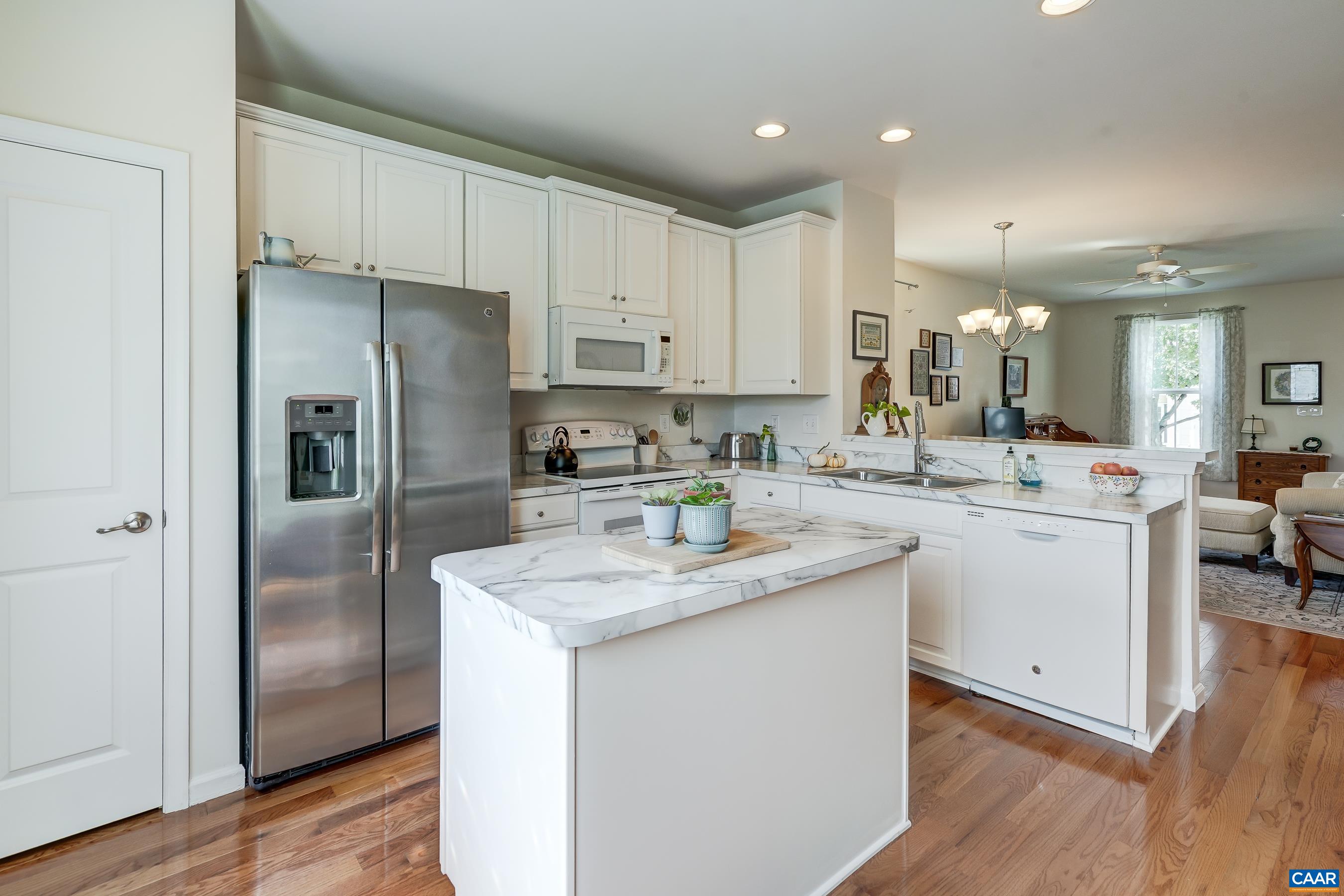 Stainless fridge, white appliances.
