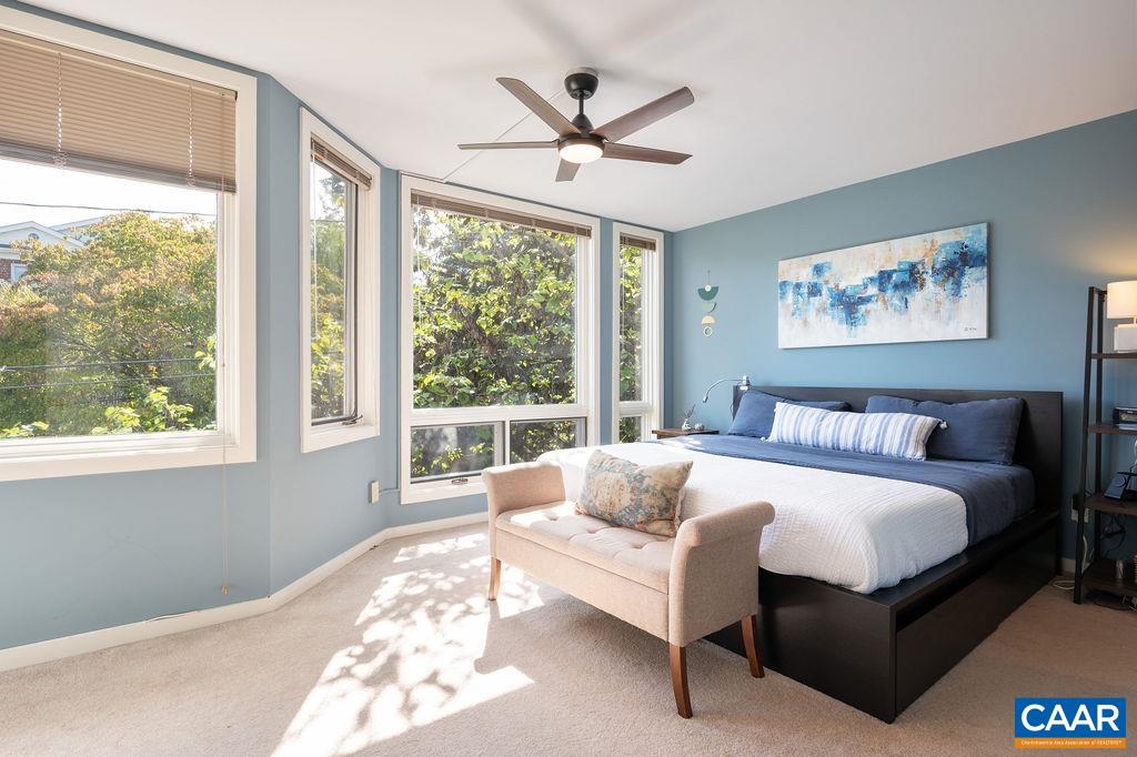 Primary bedroom also has large picture windows