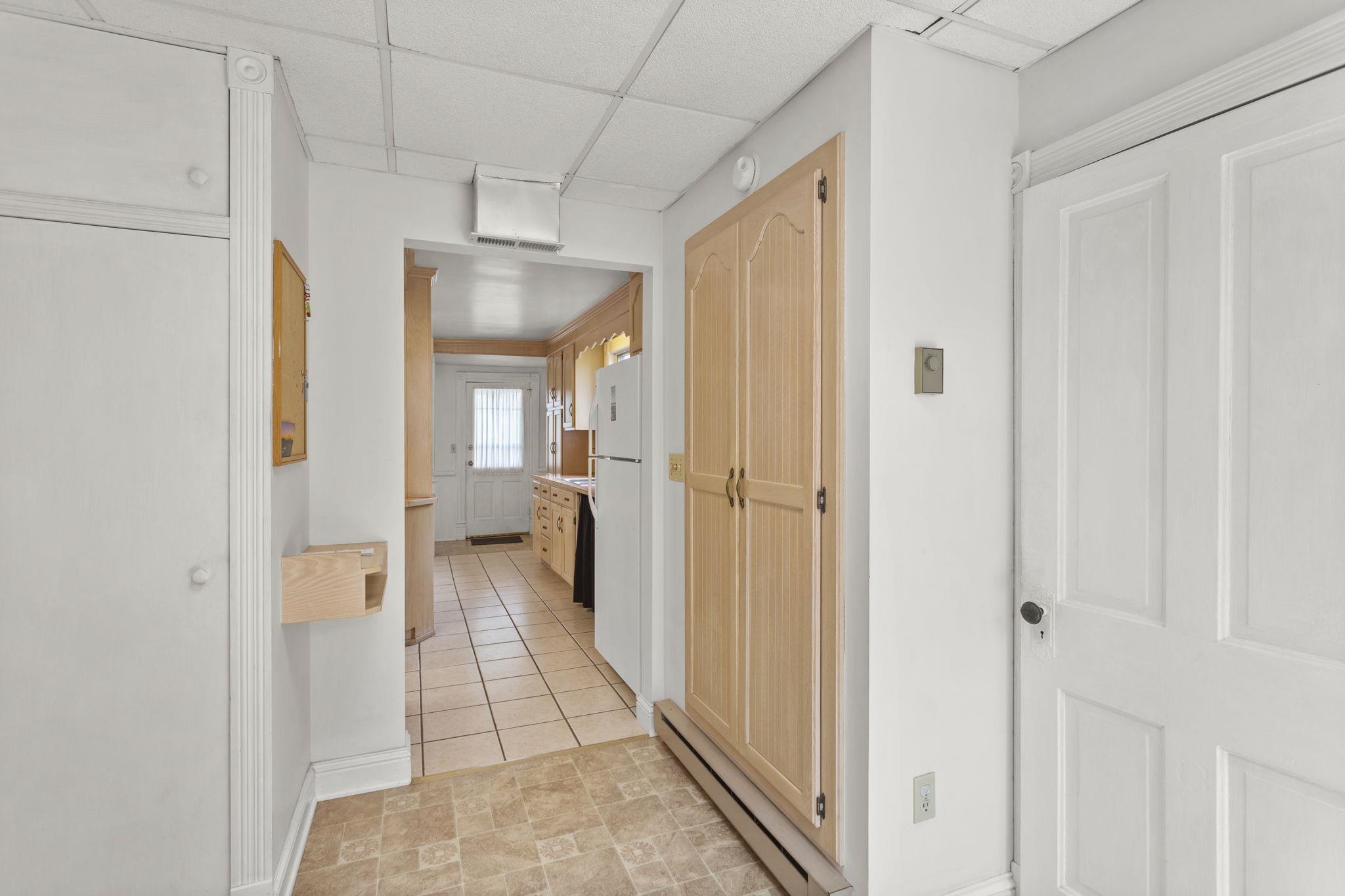 off the kitchen which leads to the laundry/half bath.