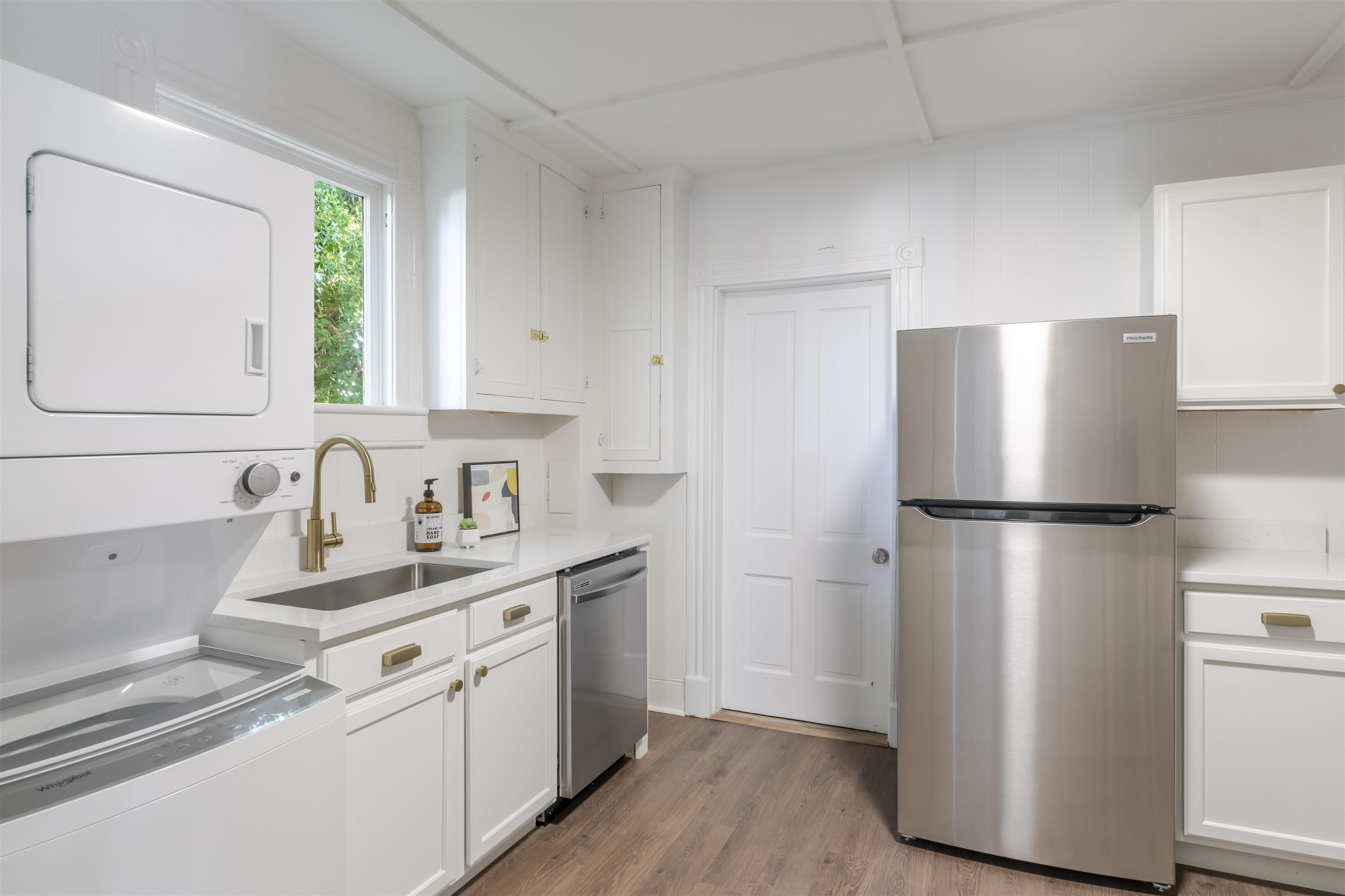 Kitchen with all new appliances, washer/dryer stack unit